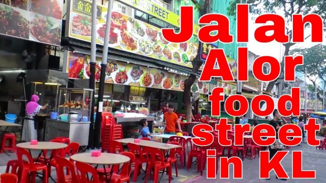 Jalan Alor Malaysia via Youtube, 1. Museum Kesenian Islam Malaysia, 2. Kuala Lumpur City Gallery, 3. Menara Kembar Petronas Malaysia, 4. Pusat Kota Kuala Lumpur (KLCC), 5. Bukit Bintang Walkway Malaysia (The Golden Triangle), 6. Jembatan Putrajaya Malaysia, 7. Taman Burung Kuala Lumpur, 8. Kuala Lumpur Convention Center, 9. Menara Kuala Lumpur (KL Tower), 10. Jalan Alor Malaysia, 11. National Mosque Malaysia (Masjid Negara), 12. Aquaria KLCC, 13. Sri Mahamariamman Malaysia, 14. Sultan Abdul Samad Building Malaysia, 15. Dataran Merdeka atau Merdeka Square Malaysia, 16. Berjaya Times Square Theme Park, 17. Masjid Jamek Malaysia, 18. Chinatown Kuala Lumpur, 19. Istana Negara Malaysia, 20. Berjaya Time Square Theme Park, 21. Batu Caves, 22. Lake Gardens (Taman Tasik Perdana), 23. Kuil Thean Hou, 24. Rumah Penghulu Abu Seman, 25. Lake Symphony – Kuala Lumpur, 26. Little India – Kuala Lumpur, 27. Railway Station and Administration Building, 28. District 21 Kuala Lumpur, 29. Petrosains Discovery Centre, 30. Kuala Lumpur National Zoo & Aquarium, 31. Wisata Religi Masjid Putrajaya, 32. Sunway Lagoon Theme Park, 33. Kuala Lumpur Forest Eco Park, 34. Istana Budaya, 35. Jalan Alor, 36. Pusat Sains Negara, 36. i-City Shah Alam, 37. Bukit Tabur, 38. Skytrex Adventure, 39. National Textile Museum, 40. Sin Sze Ya Temple, 42. Royal Malaysian Police Museum, 43. Kuala Lumpur Butterfly Park, 44. Pasar Seni, 45. Suria KLCC, 46. Taman Botani Perdana, 47. Genting Highlands, 48. Museum Negara Malaysia, 49. Taman KLCC, 50. Tugu Negara, 51. Bukit Nanas, 52. Planetarium Negara, 53. Istana Negara Kuala Lumpur, 54. Menara KL118, 55. Titiwangsa Lake Gardens, 56. Petronas Gallery, 57. KL Tower Mini Zoo, 58. KidZania Kuala Lumpur