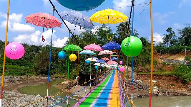 Jembatan Pelangi Rembang via Youtube, 1. Owabong Water Park, 2. Taman Wisata Pendidikan Purbasari Pancuran Mas, 3. Taman Bunga Kutabawa, 4. Wisata Alam Kampung Kurcaci, 5. Agrowisata Lembah Asri Serang, 6. Jembatan Cinta Purbalingga, 7. Sanggaluri Park Purbalingga, 8. Golaga – Goalawa Purbalingga, 9. Desa Wisata Panusupan, 10. Bukit Mertelu, 11. Alun – Alun Purbalingga, 12. Pemandian Situ Tirta Marta Desa Wisata Karangcegak, 13. Puncak Sendaren, 14. Desa Wisata Serang, 15. Jembatan Pelangi Rembang, 16. Purbasari Pancuran Mas, 17. Curug Sumba, 18. Wisata Agrobisnis Serang, 19. Bukit Cilik – Igir Wringin, 20. Wisata Buah Botania Garden (Bogar), 21. Puncak Sibarat, 22. Curug Nini, 23. Curug Silintang, 24. Bukit Njelir, 25. Taman Cinta Talagening Bobotsari, 26. Curug Duwur (Bumisari), 27. Curug Tempuran, 28. Desa Wisata Gunung Wuled, 29. Museum Uang Purbalingga, 30. River World Purbalingga, 31. Ardi Lawet Petilasan Syeh Jambu Karang, 32. Bukit Kelir, 33. Watu Geong, 34. Curug Ciputut, 35. Curug Tuntung Laut, 36. Museum Jenderal Soedirman, 37. Kolam Renang Walik Purbalingga, 38. Sungai Watu Mujur, 39. Arung Jeram Sungai Klawing, 40. Usman Janatin City Park, 41. Puncak Telkom Pratin, 42. Puncak Batur Purbalingga, 44. Wisata Pring Wulung, 45. River Tubing Klawing, 46. Lampion Tengah Sawah, 47. Bendungan Slinga, 48. Highland Serang, 49. Desa Wisata Sikopyah
