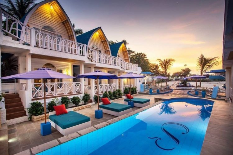 Santorini Beach Resort, 1. Good For Ya Knee Hostel & Bungalows, Akomodasi Murah Meriah Berjarak 5 Menit Jalan Kaki dari Pantai, 2. Budget Kaki Lima Tapi Ingin Akomodasi dengan Privasi Lebih? Angel’s Cottage Jawabannya, 3. Menginap dalam Suasana Eco Friendly yang Ramah Budget Bisa Kalian Dapatkan di Little Woodstock Homestay, 4. Oceane Paradise Bungalow, Cocok Bagi Kalian yang Ingin Menginap Nyaman dengan Harga Hemat, 5. Kalian Juga Dapat Mempertimbangkan Giliano Residence untuk Pilihan Akomodasi Budget nan Nyaman, 6. Ingin Menjauh Sejenak dari Peradaban Modern Tanpa Harus Jauh-jauh dari Pusat Keramaian? Coba Lirik Denaya Lodge, deh!, 7. Gili Bagaz Cottage Hadir Untuk Kalian yang Merindukan Nuansa Etnik Jawa dengan Harga Budget, 8. Walau Rate-nya Terbilang Budget, Fasilitas di Trawangan Oasis Hotel Ini Cukup Lengkap Untuk Memanjakan Wisatawan, 9. Hotel Vila Ombak, 10. Natya Hotel Gili Trawangan, 11. The Trawangan Resort, 12. Pearl of Trawangan, 13. Santorini Beach Resort, 14. Mango Dive & Bungalow
