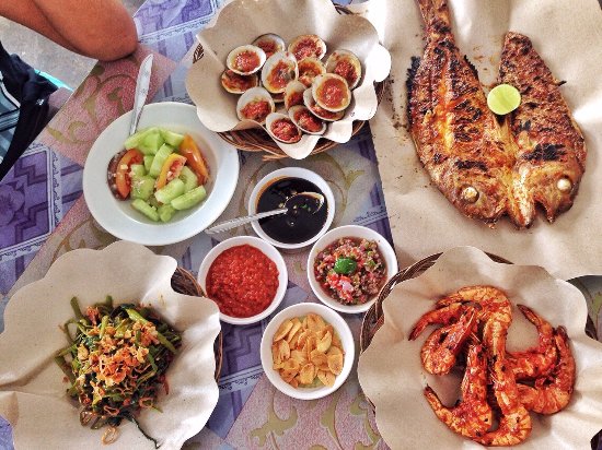 Warung Mami via Tripadvisor, 1. Sop Ikan Mak Beng Sanur, 2. Warung Mami, 3. Warung Wardani, 4. Sate Plecing Arjuna, 5. Warung D’Sawah, 6. Sanur Night Market, 7. Warung Nyoman, 8. Nasi Ayam Kedewatan Ibu Mangku, 9. Bebek Bengil Crispy Duck – Nusa Dua, 10. MamaSan Bali, 11. Nasi Pedas Bu Andika, 12. Rujak Kuah Pindang Bu Putu, 13. Revolver Espresso, 14. Seniman Coffee, 15. Bebek Goreng Laka Leke, 16. Warung Nasi Bali Men Weti (Sanur), 17. Naughty Nuri’s Warung, 18. Ayam Betutu Men Tempeh Gilimanuk, 19. Warung Laota, 20. Warung Bebek Tepi Sawah, 21. Sate Babi Bawah Pohon (Kuta), 22. Nasi Pecel Bu Tinuk, 23. Warung Liku