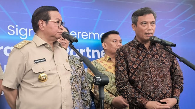 Dirut BTN Nixon L.P Napitupulu (kanan) dan Gubernur Jakarta Pramono Anung (kiri)