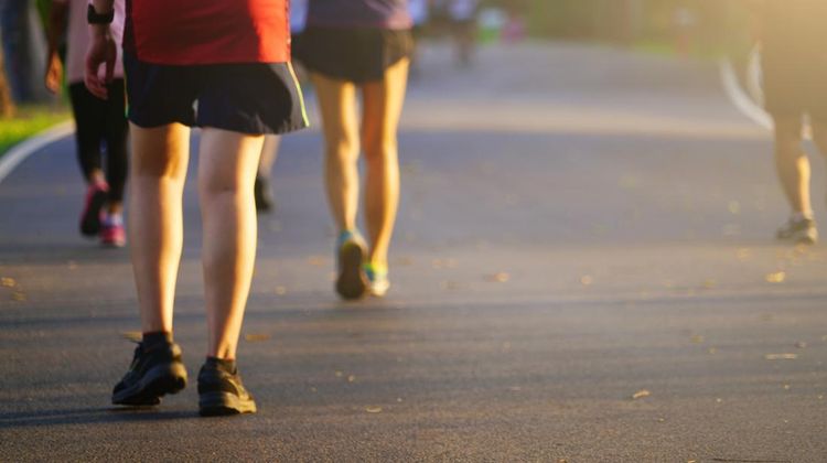 People exercise jogging running and walking on pathway at outdoors park in morning or evening with copy space, soft focus image tone.
