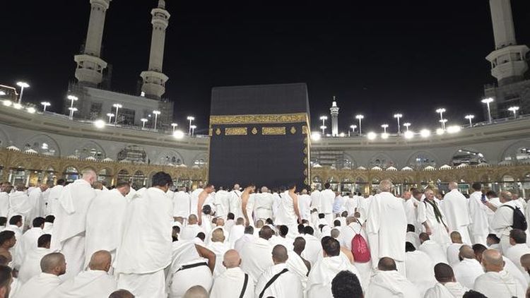 The photo depicts the spiritual activities of the Hajj and Umrah pilgrims in the holy land of Mecca&period; Muslims perform worship and pray in front of the Kaaba&period;