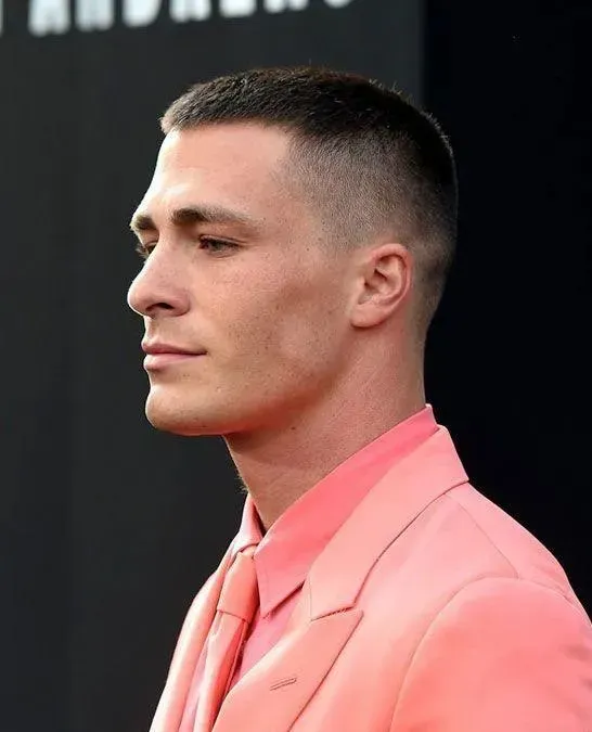 1. High and Tight Haircut, 2. Two Block, 3. Slicked-back Undercut, 4. Comma Hair, 5. Taper Fade, 6. Fluffy Hair, 7. Curtain Haircut / Curtain Bangs, 8. Mullet Hair, 9. Mandarin Haircut, 10. Buzz Cut, 11. Medium Length Haircut, 12. French Crop, 13. Layered Bowl Cut, 14. Ivy League Cut, 15. Pompadour Hairstyle