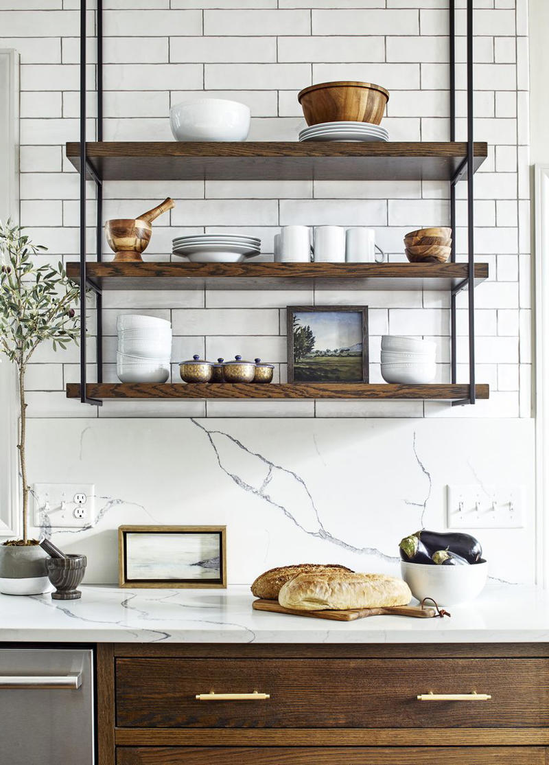 Add Sleek Open Shelving 10) Take a Maximalist Approach, 16) Make the Most of Kitchen Corners, 17) Bring in a Dining Table, 18) Mount a Metal Rack, 20) Keep It Classic, 21) Let Counters Play Double Duty, 24) Install a Pegboard Wall, 25) Add Sleek Open Shelving, 26) Go Big With Art, 29) Infuse Color With Tiles, 34) Add Task Lighting, 36) Go Bold on Top, Neutral on Bottom, 39) Get Smart With Floating Shelves, 40) Keep Most-Used Items on Shelves, 41) Extend Tile from Countertop to Ceiling, 44) Disguise Your Dishwasher, 45) Double up on Pattern and Color, 46) Try Backless Stools, 47) Craft a Wine Nook, 48) Invest in a Rolling Kitchen Cart, 49) Use Vertical Space
