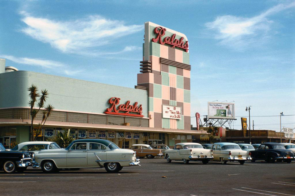 Circa 1950: Kroger Expands 1) 1915: General Store for Locals, 3) Circa 1930s: Prices by the Bargain, 6) 1945: Grocery Cart Strollers, 7) Circa 1950: Kroger Expands, 8) Circa 1950s: A Place to Socialize, 10) 1956: The Soda Bar, 11) 1956: A Family Shopping Outing, 12) Circa 1960s: Stores Start Getting Larger, 13) Circa 1960s: The Evolution of the Grocery Bag, 14) Circa 1960s: Don't Forget the Candy, 15) Circa 1960s: Bag it Up, 16) Circa 1960s: Countless Checkout Counters, 17) 1962: The Original Curbside Pickup, 18) 1968: Shopping Carts for the Mid-Century Modern Era, 19) 1968: Underground Markets, 21) 1976: Grand Opening, 22) 1980s: Big-Box is Here to Stay, 23) 1985: The Manhattan Grocery Store, 24) 1995: Kids in the Shopping Cart, 26) Circa 1990s: Don't Forget the CD Section, 27) 1990: Grocery Shopping Made Easy, 28) 1996: Sales! Sales! Sales!