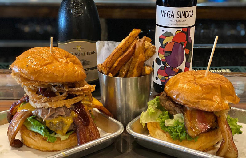 Delaware: FTC, Farmer & the Cow, Wilmington 54. Tennessee: Dyer's Single, Dyer's Burgers, Memphis, 53. Alabama: hamburger, Dub's Burgers, Athens, 52. Connecticut: The Original Burger, Louis' Lunch, New Haven, 51. California: Steakburger, The Apple Pan, Los Angeles, 50. Iowa: hamburger, B-Bops, various locations, 49. Maine: hamburger, Black Cow, Portland, 48. New Jersey: hamburger, White Manna, Hackensack, 47. New Hampshire: hamburger, Gilley’s Diner, Portsmouth, 46. Massachusetts: Hamburg, White Hut, West Springfield, 45. California: hamburger, In-N-Out Burger, various locations, 44. District of Columbia: Farmhouse Burger, Good Stuff Eatery, Georgetown, 43. Mississippi: Slugburger, Latham's Hamburger Inn, New Albany, 42. Utah: Big Ben, Burger Bar, Roy, 41. Wisconsin: hamburger, Sobelman's Pub & Grill, Milwaukee, 40. Wyoming: The Liberty Burger, Liberty Burger, Jackson, 39. Illinois: House-blend prime beef burger, Butcher & The Burger, Chicago, 38. Arizona: The Standard at The Stand Arcadia Burger Shoppe, Phoenix, 37. Colorado: Cricket Burger, The Cherry Cricket, Denver, 36. New York: Luger burger, Peter Luger Steakhouse, New York City, 35. Delaware: FTC, Farmer & the Cow, Wilmington, 34. Minnesota: Jucy Lucy, Matt’s Bar, Minneapolis, 33. Pennsylvania: hamburger, M2O Burgers & Salads, Philadelphia, 32. South Carolina: Classic, Big Gun Burger Shop, Charleston, 31. Idaho: The Classic, Holy Cow!, Nampa, 30. Kansas: House Burger, Dempsey's Burger Pub, Wichita, 29. Missouri: hamburger, Town Topic, Kansas City, 28. Nebraska: The Original, Cheeseburgers, Omaha, 27. New Mexico: Rustic, Rustic On The Green, Albuquerque, 26. Indiana: Smash burger, Workingman’s Friend, Indianapolis, 25. Vermont: Worthy Burger, Worthy Burger, South Royalton and Woodstock, 24. Arkansas: traditional hamburger, Hugo's, Fayetteville, 23. Texas: Tookie's Burger, Tookie's Hamburgers & More, Kemah, 22. Nevada: Plain Jane, Beefy's, Reno, 21. Georgia: Green Truck Classic, Green Truck Pub, Savannah, 20. New York: hamburger, All-American Hamburger Drive-In, Massapequa, 19. North Dakota: Carport, Sickies Garage Burgers & Brews, various locations, 18. Michigan: sliders, Motz’s Burgers, Detroit, 17. Michigan: Ground Round, Miller’s Bar, Dearborn, 16. Florida: hamburger, Mac's Drive-Thru, Gainesville, 15. West Virginia: Oscar, Oscar’s Breakfast, Burgers & Brews, Barboursville, 14. North Carolina: hamburger, Brooks’ Sandwich House, Charlotte, 13. Kentucky: The Purist, Bard's Burgers & Chili, Covington, 12. Maryland: Hamburger, Burger Bros., Towson, 11. Oklahoma: single onion burger, Tucker's Onion Burgers, various locations, 10. Rhode Island: Stanley Burger, Stanley’s Famous Hamburgers, Central Falls, 9. Virginia: Beauvine, Beauvine Burger Concept, Richmond, 8. Oregon: The Original 100, Hwy 101 Burger, Lincoln City, 7. Ohio: hamburger, Kewpee Hamburgers, Lima, 6. Hawaii: hamburger, Kua Aina Sandwich Shop, Haleiwa, 5. Alaska: The Burger Stop, Tommy's Burger Stop, Anchorage, 4. Montana: Hamburger, The Burger Drive, Billings, 3. Washington: Seattle Classic, Von's 1000 Spirits, Seattle, 2. Louisiana: Butcher Burger, Cochon Butcher, New Orleans