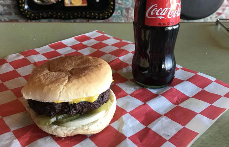 Mississippi: Slugburger, Latham's Hamburger Inn, New Albany 54. Tennessee: Dyer's Single, Dyer's Burgers, Memphis, 53. Alabama: hamburger, Dub's Burgers, Athens, 52. Connecticut: The Original Burger, Louis' Lunch, New Haven, 51. California: Steakburger, The Apple Pan, Los Angeles, 50. Iowa: hamburger, B-Bops, various locations, 49. Maine: hamburger, Black Cow, Portland, 48. New Jersey: hamburger, White Manna, Hackensack, 47. New Hampshire: hamburger, Gilley’s Diner, Portsmouth, 46. Massachusetts: Hamburg, White Hut, West Springfield, 45. California: hamburger, In-N-Out Burger, various locations, 44. District of Columbia: Farmhouse Burger, Good Stuff Eatery, Georgetown, 43. Mississippi: Slugburger, Latham's Hamburger Inn, New Albany, 42. Utah: Big Ben, Burger Bar, Roy, 41. Wisconsin: hamburger, Sobelman's Pub & Grill, Milwaukee, 40. Wyoming: The Liberty Burger, Liberty Burger, Jackson, 39. Illinois: House-blend prime beef burger, Butcher & The Burger, Chicago, 38. Arizona: The Standard at The Stand Arcadia Burger Shoppe, Phoenix, 37. Colorado: Cricket Burger, The Cherry Cricket, Denver, 36. New York: Luger burger, Peter Luger Steakhouse, New York City, 35. Delaware: FTC, Farmer & the Cow, Wilmington, 34. Minnesota: Jucy Lucy, Matt’s Bar, Minneapolis, 33. Pennsylvania: hamburger, M2O Burgers & Salads, Philadelphia, 32. South Carolina: Classic, Big Gun Burger Shop, Charleston, 31. Idaho: The Classic, Holy Cow!, Nampa, 30. Kansas: House Burger, Dempsey's Burger Pub, Wichita, 29. Missouri: hamburger, Town Topic, Kansas City, 28. Nebraska: The Original, Cheeseburgers, Omaha, 27. New Mexico: Rustic, Rustic On The Green, Albuquerque, 26. Indiana: Smash burger, Workingman’s Friend, Indianapolis, 25. Vermont: Worthy Burger, Worthy Burger, South Royalton and Woodstock, 24. Arkansas: traditional hamburger, Hugo's, Fayetteville, 23. Texas: Tookie's Burger, Tookie's Hamburgers & More, Kemah, 22. Nevada: Plain Jane, Beefy's, Reno, 21. Georgia: Green Truck Classic, Green Truck Pub, Savannah, 20. New York: hamburger, All-American Hamburger Drive-In, Massapequa, 19. North Dakota: Carport, Sickies Garage Burgers & Brews, various locations, 18. Michigan: sliders, Motz’s Burgers, Detroit, 17. Michigan: Ground Round, Miller’s Bar, Dearborn, 16. Florida: hamburger, Mac's Drive-Thru, Gainesville, 15. West Virginia: Oscar, Oscar’s Breakfast, Burgers & Brews, Barboursville, 14. North Carolina: hamburger, Brooks’ Sandwich House, Charlotte, 13. Kentucky: The Purist, Bard's Burgers & Chili, Covington, 12. Maryland: Hamburger, Burger Bros., Towson, 11. Oklahoma: single onion burger, Tucker's Onion Burgers, various locations, 10. Rhode Island: Stanley Burger, Stanley’s Famous Hamburgers, Central Falls, 9. Virginia: Beauvine, Beauvine Burger Concept, Richmond, 8. Oregon: The Original 100, Hwy 101 Burger, Lincoln City, 7. Ohio: hamburger, Kewpee Hamburgers, Lima, 6. Hawaii: hamburger, Kua Aina Sandwich Shop, Haleiwa, 5. Alaska: The Burger Stop, Tommy's Burger Stop, Anchorage, 4. Montana: Hamburger, The Burger Drive, Billings, 3. Washington: Seattle Classic, Von's 1000 Spirits, Seattle, 2. Louisiana: Butcher Burger, Cochon Butcher, New Orleans
