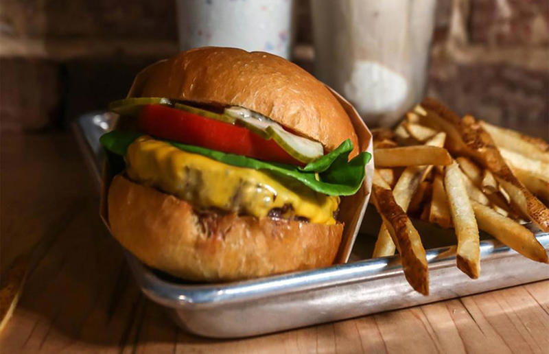 Virginia: Beauvine, Beauvine Burger Concept, Richmond 54. Tennessee: Dyer's Single, Dyer's Burgers, Memphis, 53. Alabama: hamburger, Dub's Burgers, Athens, 52. Connecticut: The Original Burger, Louis' Lunch, New Haven, 51. California: Steakburger, The Apple Pan, Los Angeles, 50. Iowa: hamburger, B-Bops, various locations, 49. Maine: hamburger, Black Cow, Portland, 48. New Jersey: hamburger, White Manna, Hackensack, 47. New Hampshire: hamburger, Gilley’s Diner, Portsmouth, 46. Massachusetts: Hamburg, White Hut, West Springfield, 45. California: hamburger, In-N-Out Burger, various locations, 44. District of Columbia: Farmhouse Burger, Good Stuff Eatery, Georgetown, 43. Mississippi: Slugburger, Latham's Hamburger Inn, New Albany, 42. Utah: Big Ben, Burger Bar, Roy, 41. Wisconsin: hamburger, Sobelman's Pub & Grill, Milwaukee, 40. Wyoming: The Liberty Burger, Liberty Burger, Jackson, 39. Illinois: House-blend prime beef burger, Butcher & The Burger, Chicago, 38. Arizona: The Standard at The Stand Arcadia Burger Shoppe, Phoenix, 37. Colorado: Cricket Burger, The Cherry Cricket, Denver, 36. New York: Luger burger, Peter Luger Steakhouse, New York City, 35. Delaware: FTC, Farmer & the Cow, Wilmington, 34. Minnesota: Jucy Lucy, Matt’s Bar, Minneapolis, 33. Pennsylvania: hamburger, M2O Burgers & Salads, Philadelphia, 32. South Carolina: Classic, Big Gun Burger Shop, Charleston, 31. Idaho: The Classic, Holy Cow!, Nampa, 30. Kansas: House Burger, Dempsey's Burger Pub, Wichita, 29. Missouri: hamburger, Town Topic, Kansas City, 28. Nebraska: The Original, Cheeseburgers, Omaha, 27. New Mexico: Rustic, Rustic On The Green, Albuquerque, 26. Indiana: Smash burger, Workingman’s Friend, Indianapolis, 25. Vermont: Worthy Burger, Worthy Burger, South Royalton and Woodstock, 24. Arkansas: traditional hamburger, Hugo's, Fayetteville, 23. Texas: Tookie's Burger, Tookie's Hamburgers & More, Kemah, 22. Nevada: Plain Jane, Beefy's, Reno, 21. Georgia: Green Truck Classic, Green Truck Pub, Savannah, 20. New York: hamburger, All-American Hamburger Drive-In, Massapequa, 19. North Dakota: Carport, Sickies Garage Burgers & Brews, various locations, 18. Michigan: sliders, Motz’s Burgers, Detroit, 17. Michigan: Ground Round, Miller’s Bar, Dearborn, 16. Florida: hamburger, Mac's Drive-Thru, Gainesville, 15. West Virginia: Oscar, Oscar’s Breakfast, Burgers & Brews, Barboursville, 14. North Carolina: hamburger, Brooks’ Sandwich House, Charlotte, 13. Kentucky: The Purist, Bard's Burgers & Chili, Covington, 12. Maryland: Hamburger, Burger Bros., Towson, 11. Oklahoma: single onion burger, Tucker's Onion Burgers, various locations, 10. Rhode Island: Stanley Burger, Stanley’s Famous Hamburgers, Central Falls, 9. Virginia: Beauvine, Beauvine Burger Concept, Richmond, 8. Oregon: The Original 100, Hwy 101 Burger, Lincoln City, 7. Ohio: hamburger, Kewpee Hamburgers, Lima, 6. Hawaii: hamburger, Kua Aina Sandwich Shop, Haleiwa, 5. Alaska: The Burger Stop, Tommy's Burger Stop, Anchorage, 4. Montana: Hamburger, The Burger Drive, Billings, 3. Washington: Seattle Classic, Von's 1000 Spirits, Seattle, 2. Louisiana: Butcher Burger, Cochon Butcher, New Orleans