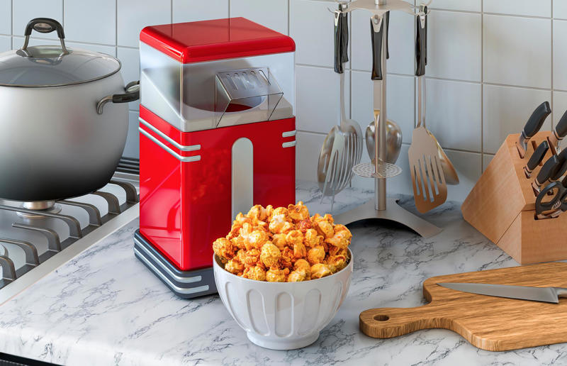 Popcorn maker 29. Microwave egg poacher, 28. Garlic crusher, 27. Electric juicer, 26. Meat-shredding claws, 25. Electric egg boiler, 24. Salad spinner, 23. Yolk separator, 22. Burger press, 21. Hot dog maker, 20. Electric can opener, 19. Avocado keepers, 18. Yogurt maker, 17. Herb keeper, 16. Mandoline slicer, 15. Breakfast sandwich maker, 14. Whipped cream dispenser, 13. Herb scissors, 12. Spiralizer, 11. Strawberry huller, 10. Fancy cocktail set, 9. Electric kitchen knife, 8. Bacon press, 7. Popcorn maker, 6. Electric salt and pepper grinders, 5. Cupcake/muffin maker, 4. Carrot sharpener, 3. Melon baller, 2. Pizza scissors