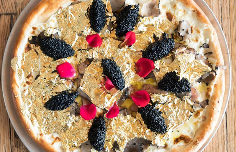 Gold pizza, $2,980 19. Bennelong sausage roll, Bennelong, Sydney, Australia, 18. The Golden Nugget, COQODAQ, New York City, New York, USA, 17. Hot Dog, Mischa, New York City, New York, USA, 16. Millionaire's Milkshake, Grill 'n' Shake, Cardiff, Wales, UK, 15. Dragon Dog, DougieDog Diner, Vancouver, Canada, 14. Barclay Prime Cheesesteak, Barclay Prime, Philadelphia, Pennsylvania, USA, 13. World's Most Expensive Fries, Serendipity3, New York City, New York, USA, 12. Quintessential Grilled Cheese Sandwich, Serendipity3, New York City, New York, USA, 11. Juuni Ban hot dog, Tokyo Dog, Seattle, Washington, USA, 10. Billion Dollar Popcorn, Berco's Popcorn, Chicago, Illinois, USA, 9. Fried Chicken & Osetra Caviar, Momofuku Noodle Bar, New York City, New York, USA, 8. Golden Opulence Sundae, Serendipity3, New York City, New York, USA, 7. ,000 bagel, Westin New York at Times Square, New York City, New York, USA, 6. Guinness World Record 24k Pizza, Industry Kitchen, New York City, New York, USA, 5. The Golden Boy burger, De Daltons, Voorthuizen, Netherlands, 4. The Posh Pie, The Lord Dudley Hotel, Sydney, Australia, 3. Louis XIII pizza, various locations, Italy, 2. Meat pie, The Fence Gate Inn, Burnley, Lancashire, England, UK