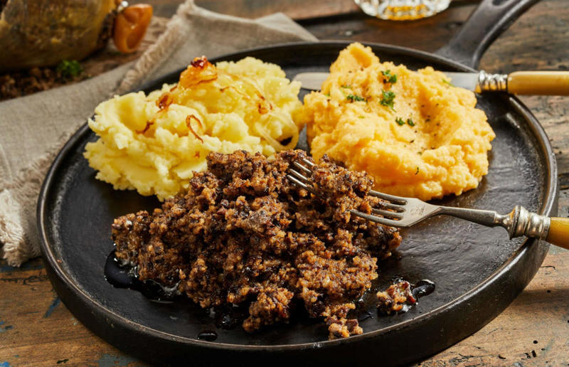 90. Peri peri chicken, Mozambique, 89. Sauerbraten, Germany, 88. Massaman, Thailand, 87. Spanakopita, Cyprus and Greece, 86. Cassoulet, France, 85. Banitsa, Bulgaria, 84. Barramundi, Australia, 83. Pastel de choclo, Chile, 82. Mole, Mexico, 81. Borscht, Ukraine, 80. Plov, Uzbekistan, 79. Bunny chow, South Africa, 78. Käsespätzle/ Käsknöpfle, Central Europe, 77. Chicken rice, Singapore, 76. Adobo, Philippines, 75. Rösti, Switzerland, 74. Falafel, Middle East, 73. Hoppers, Sri Lanka, 72. Nasi lemak, Malaysia, 71. Pupusa, El Salvador, 70. Beef rendang, Indonesia, 69. Tortilla de patatas, Spain, 68. French onion soup, France, 67. Colcannon, Ireland, 66. Bobotie, South Africa, 65. Haggis, Scotland, 64. Tamales, Central and South America, 63. Wiener schnitzel, Austria, 62. Feijoada, Brazil, 61. Souvlaki, Greece, 60. Laksa, Malaysia, 59. Clam chowder, USA, 58. Raclette, Switzerland, 57. Smørrebrød, Denmark, 56. Jollof rice, West Africa, 55. Poutine, Canada, 54. Goulash, Hungary, 53. Pho, Vietnam, 52. Biryani, India, 51. Arepa, Colombia and Venezuela, 50. Shawarma, Middle East, 49. Beef stroganoff, Russia, 48. Som tam, Laos, 47. Cacio e pepe, Italy, 46. Bouillabaisse, France, 45. Khachapuri, Georgia, 44. Ceviche, Peru, 43. Quesadilla, Mexico, 42. Masala dosa, India, 41. Moules frites, Belgium, 40. Köttbullar, Sweden, 39. Welsh rarebit, Wales, 38. Pierogi, Poland, 37. Poke, USA, 36. Tagine, Morocco, 35. Dim sum, China, 34. Gumbo, USA, 33. Kebab, Turkey, 32. Jerk chicken, Jamaica, 31. Singapore noodles, Hong Kong, 30. Asado, Argentina, 29. Beef Wellington, England, 28. Moussaka, Greece, 27. Tahdig, Iran, 26. Murgh makhani, India, 25. Gnocchi, Italy, 24. Sushi, Japan, 23. Texas-style barbecue, USA, 22. Fish and chips, UK, 21. Carbonara, Italy, 20. Tom yum soup, Thailand, 19. Cataplana, Portugal, 18. Mezze, Middle East, 17. Pad Thai, Thailand, 16. Steak frites, France, 15. Shakshuka, Middle East, 14. Tapas, Spain, 13. Gua bao, Taiwan, 12. Boeuf bourguignon, France, 11. Peking duck, China, 10. Chicken parmigiana, USA, 9. Bibimbap, South Korea, 8. Paella, Spain, 7. Tacos, Mexico, 6. Southern fried chicken, USA, 5. Sausage and mash, UK, 4. Ragù alla Bolognese, Italy, 3. Ramen, Japan, 2. Hamburger, USA