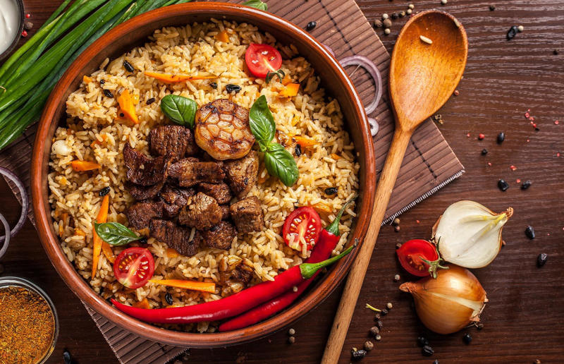 90. Peri peri chicken, Mozambique, 89. Sauerbraten, Germany, 88. Massaman, Thailand, 87. Spanakopita, Cyprus and Greece, 86. Cassoulet, France, 85. Banitsa, Bulgaria, 84. Barramundi, Australia, 83. Pastel de choclo, Chile, 82. Mole, Mexico, 81. Borscht, Ukraine, 80. Plov, Uzbekistan, 79. Bunny chow, South Africa, 78. Käsespätzle/ Käsknöpfle, Central Europe, 77. Chicken rice, Singapore, 76. Adobo, Philippines, 75. Rösti, Switzerland, 74. Falafel, Middle East, 73. Hoppers, Sri Lanka, 72. Nasi lemak, Malaysia, 71. Pupusa, El Salvador, 70. Beef rendang, Indonesia, 69. Tortilla de patatas, Spain, 68. French onion soup, France, 67. Colcannon, Ireland, 66. Bobotie, South Africa, 65. Haggis, Scotland, 64. Tamales, Central and South America, 63. Wiener schnitzel, Austria, 62. Feijoada, Brazil, 61. Souvlaki, Greece, 60. Laksa, Malaysia, 59. Clam chowder, USA, 58. Raclette, Switzerland, 57. Smørrebrød, Denmark, 56. Jollof rice, West Africa, 55. Poutine, Canada, 54. Goulash, Hungary, 53. Pho, Vietnam, 52. Biryani, India, 51. Arepa, Colombia and Venezuela, 50. Shawarma, Middle East, 49. Beef stroganoff, Russia, 48. Som tam, Laos, 47. Cacio e pepe, Italy, 46. Bouillabaisse, France, 45. Khachapuri, Georgia, 44. Ceviche, Peru, 43. Quesadilla, Mexico, 42. Masala dosa, India, 41. Moules frites, Belgium, 40. Köttbullar, Sweden, 39. Welsh rarebit, Wales, 38. Pierogi, Poland, 37. Poke, USA, 36. Tagine, Morocco, 35. Dim sum, China, 34. Gumbo, USA, 33. Kebab, Turkey, 32. Jerk chicken, Jamaica, 31. Singapore noodles, Hong Kong, 30. Asado, Argentina, 29. Beef Wellington, England, 28. Moussaka, Greece, 27. Tahdig, Iran, 26. Murgh makhani, India, 25. Gnocchi, Italy, 24. Sushi, Japan, 23. Texas-style barbecue, USA, 22. Fish and chips, UK, 21. Carbonara, Italy, 20. Tom yum soup, Thailand, 19. Cataplana, Portugal, 18. Mezze, Middle East, 17. Pad Thai, Thailand, 16. Steak frites, France, 15. Shakshuka, Middle East, 14. Tapas, Spain, 13. Gua bao, Taiwan, 12. Boeuf bourguignon, France, 11. Peking duck, China, 10. Chicken parmigiana, USA, 9. Bibimbap, South Korea, 8. Paella, Spain, 7. Tacos, Mexico, 6. Southern fried chicken, USA, 5. Sausage and mash, UK, 4. Ragù alla Bolognese, Italy, 3. Ramen, Japan, 2. Hamburger, USA