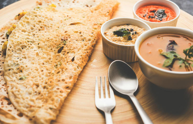 90. Peri peri chicken, Mozambique, 89. Sauerbraten, Germany, 88. Massaman, Thailand, 87. Spanakopita, Cyprus and Greece, 86. Cassoulet, France, 85. Banitsa, Bulgaria, 84. Barramundi, Australia, 83. Pastel de choclo, Chile, 82. Mole, Mexico, 81. Borscht, Ukraine, 80. Plov, Uzbekistan, 79. Bunny chow, South Africa, 78. Käsespätzle/ Käsknöpfle, Central Europe, 77. Chicken rice, Singapore, 76. Adobo, Philippines, 75. Rösti, Switzerland, 74. Falafel, Middle East, 73. Hoppers, Sri Lanka, 72. Nasi lemak, Malaysia, 71. Pupusa, El Salvador, 70. Beef rendang, Indonesia, 69. Tortilla de patatas, Spain, 68. French onion soup, France, 67. Colcannon, Ireland, 66. Bobotie, South Africa, 65. Haggis, Scotland, 64. Tamales, Central and South America, 63. Wiener schnitzel, Austria, 62. Feijoada, Brazil, 61. Souvlaki, Greece, 60. Laksa, Malaysia, 59. Clam chowder, USA, 58. Raclette, Switzerland, 57. Smørrebrød, Denmark, 56. Jollof rice, West Africa, 55. Poutine, Canada, 54. Goulash, Hungary, 53. Pho, Vietnam, 52. Biryani, India, 51. Arepa, Colombia and Venezuela, 50. Shawarma, Middle East, 49. Beef stroganoff, Russia, 48. Som tam, Laos, 47. Cacio e pepe, Italy, 46. Bouillabaisse, France, 45. Khachapuri, Georgia, 44. Ceviche, Peru, 43. Quesadilla, Mexico, 42. Masala dosa, India, 41. Moules frites, Belgium, 40. Köttbullar, Sweden, 39. Welsh rarebit, Wales, 38. Pierogi, Poland, 37. Poke, USA, 36. Tagine, Morocco, 35. Dim sum, China, 34. Gumbo, USA, 33. Kebab, Turkey, 32. Jerk chicken, Jamaica, 31. Singapore noodles, Hong Kong, 30. Asado, Argentina, 29. Beef Wellington, England, 28. Moussaka, Greece, 27. Tahdig, Iran, 26. Murgh makhani, India, 25. Gnocchi, Italy, 24. Sushi, Japan, 23. Texas-style barbecue, USA, 22. Fish and chips, UK, 21. Carbonara, Italy, 20. Tom yum soup, Thailand, 19. Cataplana, Portugal, 18. Mezze, Middle East, 17. Pad Thai, Thailand, 16. Steak frites, France, 15. Shakshuka, Middle East, 14. Tapas, Spain, 13. Gua bao, Taiwan, 12. Boeuf bourguignon, France, 11. Peking duck, China, 10. Chicken parmigiana, USA, 9. Bibimbap, South Korea, 8. Paella, Spain, 7. Tacos, Mexico, 6. Southern fried chicken, USA, 5. Sausage and mash, UK, 4. Ragù alla Bolognese, Italy, 3. Ramen, Japan, 2. Hamburger, USA