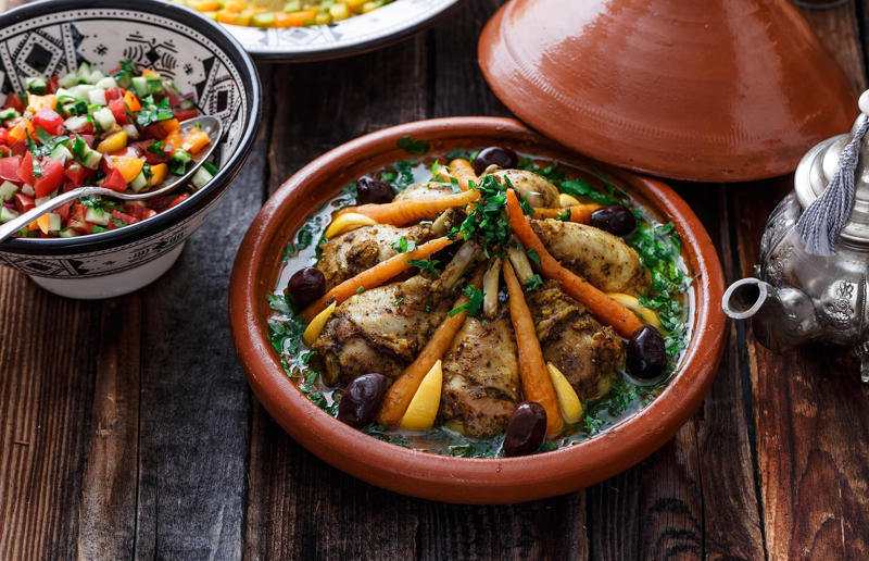 90. Peri peri chicken, Mozambique, 89. Sauerbraten, Germany, 88. Massaman, Thailand, 87. Spanakopita, Cyprus and Greece, 86. Cassoulet, France, 85. Banitsa, Bulgaria, 84. Barramundi, Australia, 83. Pastel de choclo, Chile, 82. Mole, Mexico, 81. Borscht, Ukraine, 80. Plov, Uzbekistan, 79. Bunny chow, South Africa, 78. Käsespätzle/ Käsknöpfle, Central Europe, 77. Chicken rice, Singapore, 76. Adobo, Philippines, 75. Rösti, Switzerland, 74. Falafel, Middle East, 73. Hoppers, Sri Lanka, 72. Nasi lemak, Malaysia, 71. Pupusa, El Salvador, 70. Beef rendang, Indonesia, 69. Tortilla de patatas, Spain, 68. French onion soup, France, 67. Colcannon, Ireland, 66. Bobotie, South Africa, 65. Haggis, Scotland, 64. Tamales, Central and South America, 63. Wiener schnitzel, Austria, 62. Feijoada, Brazil, 61. Souvlaki, Greece, 60. Laksa, Malaysia, 59. Clam chowder, USA, 58. Raclette, Switzerland, 57. Smørrebrød, Denmark, 56. Jollof rice, West Africa, 55. Poutine, Canada, 54. Goulash, Hungary, 53. Pho, Vietnam, 52. Biryani, India, 51. Arepa, Colombia and Venezuela, 50. Shawarma, Middle East, 49. Beef stroganoff, Russia, 48. Som tam, Laos, 47. Cacio e pepe, Italy, 46. Bouillabaisse, France, 45. Khachapuri, Georgia, 44. Ceviche, Peru, 43. Quesadilla, Mexico, 42. Masala dosa, India, 41. Moules frites, Belgium, 40. Köttbullar, Sweden, 39. Welsh rarebit, Wales, 38. Pierogi, Poland, 37. Poke, USA, 36. Tagine, Morocco, 35. Dim sum, China, 34. Gumbo, USA, 33. Kebab, Turkey, 32. Jerk chicken, Jamaica, 31. Singapore noodles, Hong Kong, 30. Asado, Argentina, 29. Beef Wellington, England, 28. Moussaka, Greece, 27. Tahdig, Iran, 26. Murgh makhani, India, 25. Gnocchi, Italy, 24. Sushi, Japan, 23. Texas-style barbecue, USA, 22. Fish and chips, UK, 21. Carbonara, Italy, 20. Tom yum soup, Thailand, 19. Cataplana, Portugal, 18. Mezze, Middle East, 17. Pad Thai, Thailand, 16. Steak frites, France, 15. Shakshuka, Middle East, 14. Tapas, Spain, 13. Gua bao, Taiwan, 12. Boeuf bourguignon, France, 11. Peking duck, China, 10. Chicken parmigiana, USA, 9. Bibimbap, South Korea, 8. Paella, Spain, 7. Tacos, Mexico, 6. Southern fried chicken, USA, 5. Sausage and mash, UK, 4. Ragù alla Bolognese, Italy, 3. Ramen, Japan, 2. Hamburger, USA