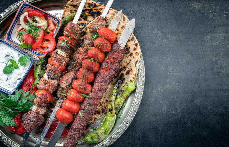 90. Peri peri chicken, Mozambique, 89. Sauerbraten, Germany, 88. Massaman, Thailand, 87. Spanakopita, Cyprus and Greece, 86. Cassoulet, France, 85. Banitsa, Bulgaria, 84. Barramundi, Australia, 83. Pastel de choclo, Chile, 82. Mole, Mexico, 81. Borscht, Ukraine, 80. Plov, Uzbekistan, 79. Bunny chow, South Africa, 78. Käsespätzle/ Käsknöpfle, Central Europe, 77. Chicken rice, Singapore, 76. Adobo, Philippines, 75. Rösti, Switzerland, 74. Falafel, Middle East, 73. Hoppers, Sri Lanka, 72. Nasi lemak, Malaysia, 71. Pupusa, El Salvador, 70. Beef rendang, Indonesia, 69. Tortilla de patatas, Spain, 68. French onion soup, France, 67. Colcannon, Ireland, 66. Bobotie, South Africa, 65. Haggis, Scotland, 64. Tamales, Central and South America, 63. Wiener schnitzel, Austria, 62. Feijoada, Brazil, 61. Souvlaki, Greece, 60. Laksa, Malaysia, 59. Clam chowder, USA, 58. Raclette, Switzerland, 57. Smørrebrød, Denmark, 56. Jollof rice, West Africa, 55. Poutine, Canada, 54. Goulash, Hungary, 53. Pho, Vietnam, 52. Biryani, India, 51. Arepa, Colombia and Venezuela, 50. Shawarma, Middle East, 49. Beef stroganoff, Russia, 48. Som tam, Laos, 47. Cacio e pepe, Italy, 46. Bouillabaisse, France, 45. Khachapuri, Georgia, 44. Ceviche, Peru, 43. Quesadilla, Mexico, 42. Masala dosa, India, 41. Moules frites, Belgium, 40. Köttbullar, Sweden, 39. Welsh rarebit, Wales, 38. Pierogi, Poland, 37. Poke, USA, 36. Tagine, Morocco, 35. Dim sum, China, 34. Gumbo, USA, 33. Kebab, Turkey, 32. Jerk chicken, Jamaica, 31. Singapore noodles, Hong Kong, 30. Asado, Argentina, 29. Beef Wellington, England, 28. Moussaka, Greece, 27. Tahdig, Iran, 26. Murgh makhani, India, 25. Gnocchi, Italy, 24. Sushi, Japan, 23. Texas-style barbecue, USA, 22. Fish and chips, UK, 21. Carbonara, Italy, 20. Tom yum soup, Thailand, 19. Cataplana, Portugal, 18. Mezze, Middle East, 17. Pad Thai, Thailand, 16. Steak frites, France, 15. Shakshuka, Middle East, 14. Tapas, Spain, 13. Gua bao, Taiwan, 12. Boeuf bourguignon, France, 11. Peking duck, China, 10. Chicken parmigiana, USA, 9. Bibimbap, South Korea, 8. Paella, Spain, 7. Tacos, Mexico, 6. Southern fried chicken, USA, 5. Sausage and mash, UK, 4. Ragù alla Bolognese, Italy, 3. Ramen, Japan, 2. Hamburger, USA