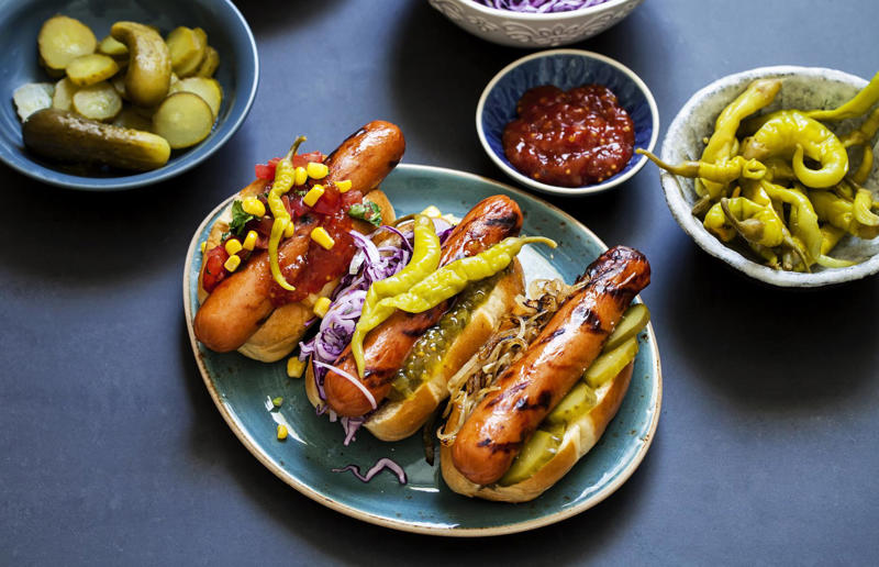 33. Gherkin and onion, 32. Crispy onions and mayo, 31. Fresh salad, 30. Vegan dog, 29. Omelette-wrapped dog, 28. Rocket, mustard and mayo, 27. Bread-free dog, 26. Sweetcorn and pickles, 25. South Korean–style dog, 24. Crunchy crisps, 23. Baguette and balsamic, 22. Tex-Mex dog, 21. South African–style dog, 20. Dough-baked dog, 19. Chilean-style dog, 18. Kimchi, hot sauce and black sesame seeds, 17. Vietnamese-style dog, 16. Spicy carrot relish, 15. Seattle-style dog, 14. Pastry-wrapped dog, 13. Creamy slaw, 12. Polish Boy–style dog, 11. Veggie bean chilli, 10. Cheese melt, 9. Argentinian-style dog, 8. Sonoran-style dog, 7. BLT hot dog, 6. Chilli dog, 5. Bacon-wrapped dog, 4. Caramelised red onion, 3. Chicago-style dog, 2. German-style dog