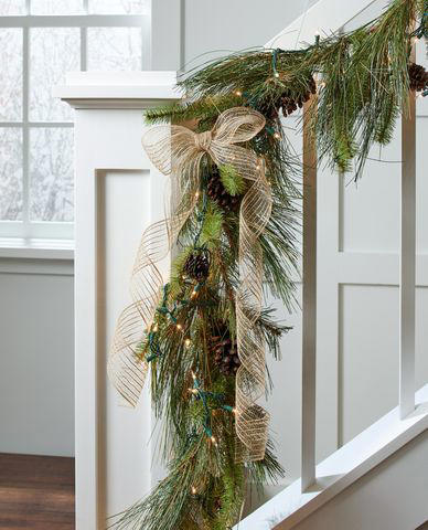 1. A Return to Classic Decor, 2. A Mix of New, Repurposed, and Secondhand, 3. Statement Bows, 4. Moody Colors, Neutrals, and Soft Metallics, 5. Mixed Greenery Wreaths, 6. Elevated Outdoor Decor, 7. Streamlined and Textured Christmas Centerpieces, 8. Simple Garlands and Trees