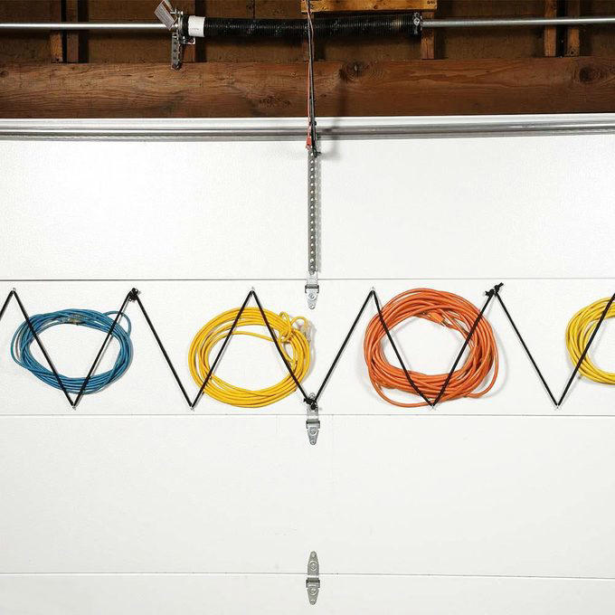 Magnetic Toolbox Labels, Pallet Dolly, Hang Anything, Handy Rag Cutter, Floor Ruler, Small Shop Space Saver, DIY Garage Storage for Cords and Hoses, Repurpose a Pallet for DIY Garage Storage, Corral Sports Gear, Overhead DIY Garage Storage System, Sliding Pegboard Storage System, Lockable Garage Storage Cabinet, Rotating Corner Shelves, Fold-Up Workbench, Garden/Garage Tool Caddy, Garage Storage Tubes, Roll-Around Workshop, Upcycled Garage Storage Idea, Garage Door Extension Cord Storage, Under-Joist Shelf