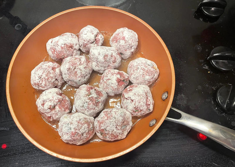 Before making the meatballs, we just need to do some quick prep., Then, mix everything together with your hands., Once your mixture is ready, start shaping the meatballs., Add the meatballs, one by one, into the pan., Use two forks to gently rotate each meatball every two minutes., It will take about 10 minutes to cook the meatballs.