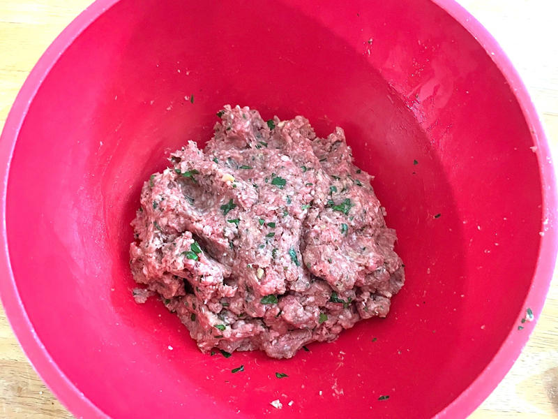 Before making the meatballs, we just need to do some quick prep., Then, mix everything together with your hands., Once your mixture is ready, start shaping the meatballs., Add the meatballs, one by one, into the pan., Use two forks to gently rotate each meatball every two minutes., It will take about 10 minutes to cook the meatballs.