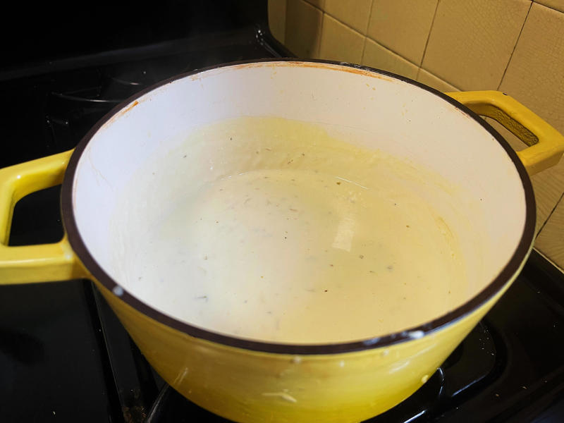 Next, I cooked the macaroni noodles., The recipe calls for a whopping 8 tablespoons of unsalted butter., I then added the hot milk into the flour-and-butter mixture., While the squash was roasting, I started cooking the onions.