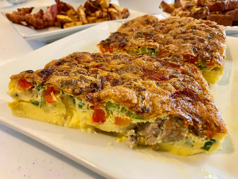 I started out with bacon, The bacon came out perfectly crispy, Next, I made breakfast potatoes, These home fries came out a little overcooked, For my 3rd recipe, I whipped up eggs in a basket, Next, I tried making an air-fryer frittata, For my final recipe, I attempted to make French toast, I barely had to add syrup for this recipe to taste good