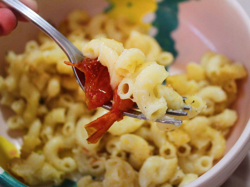 Next, I cooked the macaroni noodles., The recipe calls for a whopping 8 tablespoons of unsalted butter., I then added the hot milk into the flour-and-butter mixture., While the squash was roasting, I started cooking the onions.