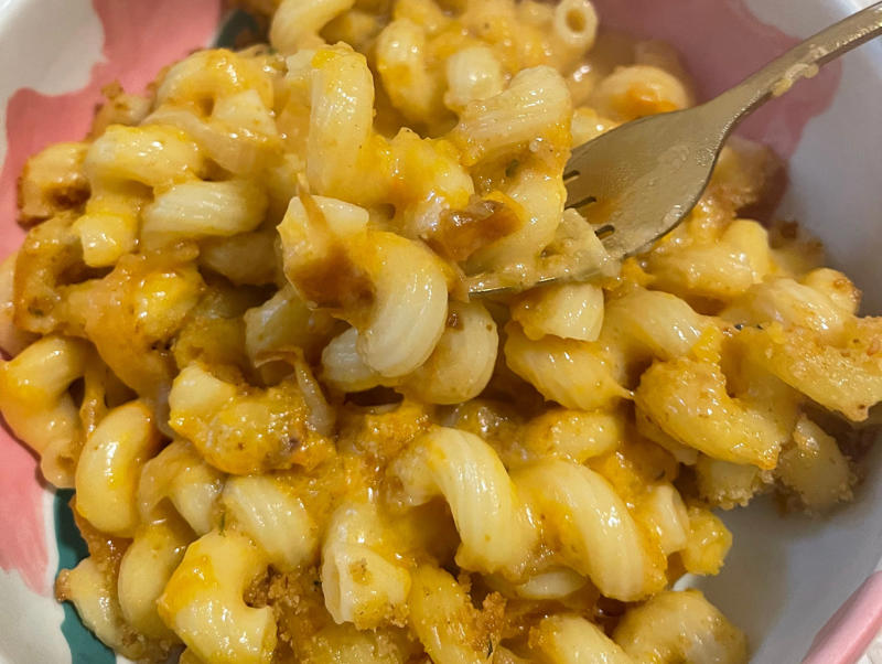 Next, I cooked the macaroni noodles., The recipe calls for a whopping 8 tablespoons of unsalted butter., I then added the hot milk into the flour-and-butter mixture., While the squash was roasting, I started cooking the onions.