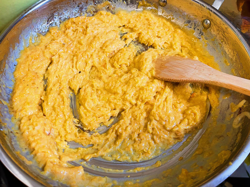 Next, I cooked the macaroni noodles., The recipe calls for a whopping 8 tablespoons of unsalted butter., I then added the hot milk into the flour-and-butter mixture., While the squash was roasting, I started cooking the onions.