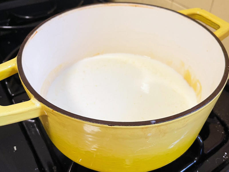 Next, I cooked the macaroni noodles., The recipe calls for a whopping 8 tablespoons of unsalted butter., I then added the hot milk into the flour-and-butter mixture., While the squash was roasting, I started cooking the onions.