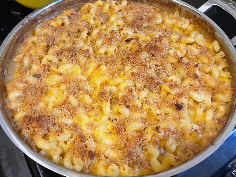 Next, I cooked the macaroni noodles., The recipe calls for a whopping 8 tablespoons of unsalted butter., I then added the hot milk into the flour-and-butter mixture., While the squash was roasting, I started cooking the onions.