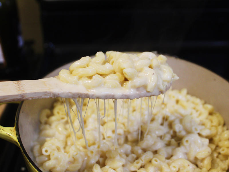 Next, I cooked the macaroni noodles., The recipe calls for a whopping 8 tablespoons of unsalted butter., I then added the hot milk into the flour-and-butter mixture., While the squash was roasting, I started cooking the onions.