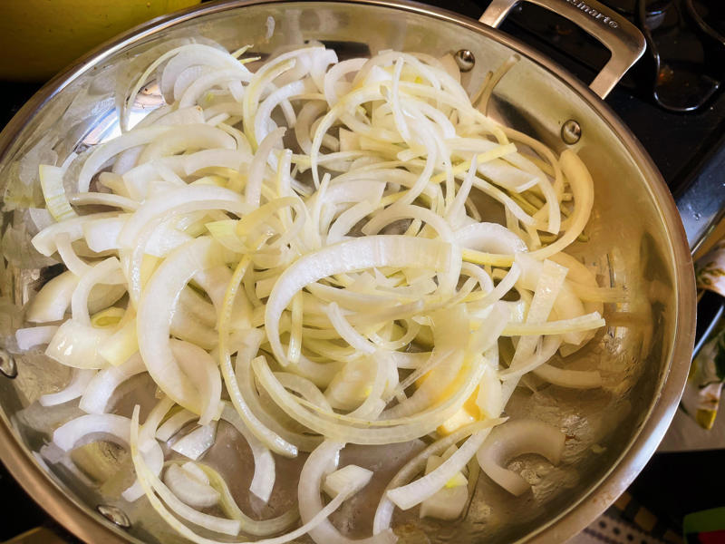 Next, I cooked the macaroni noodles., The recipe calls for a whopping 8 tablespoons of unsalted butter., I then added the hot milk into the flour-and-butter mixture., While the squash was roasting, I started cooking the onions.