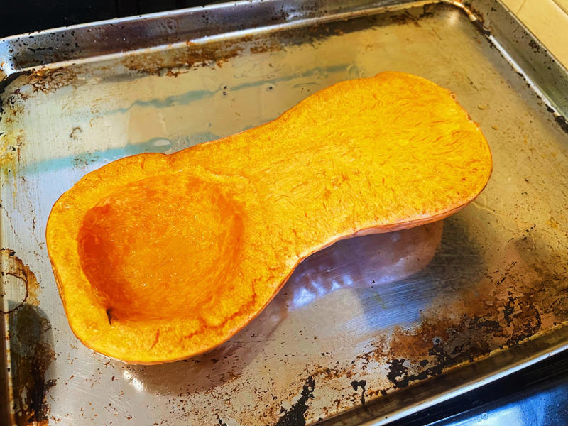 Next, I cooked the macaroni noodles., The recipe calls for a whopping 8 tablespoons of unsalted butter., I then added the hot milk into the flour-and-butter mixture., While the squash was roasting, I started cooking the onions.