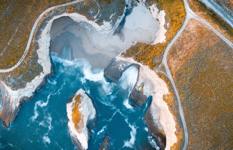 Bird's-eye views you won't believe are real, Konditaget Luders, Copenhagen, Denmark, Ajuda Botanical Garden, Lisbon, Portugal, Henningsvaer football pitch, Lofoten Islands, Norway, Guanajuato, Mexico, Innis Chonnel Castle, Loch Awe, Scotland, Tegallalang rice terraces, Indonesia, Hong Kong, Salt Pans, Gozo, Malta, Shark Fin Cove, Davenport, California, USA, Koh Lipe, Thailand, Golden Gate Bridge, San Francisco, California, USA, Grace Bay, Turks and Caicos Islands, Namib Desert, Namibia, Transfagarasan, Romania, Niagara Falls, Canada/USA, New York City, New York, USA, Road near Laki Volcano, Iceland, Atacama Desert, Chile, San Francisco, California, USA, Na Pali Coast State Wilderness Park, Kauai Island, Hawaii, USA, Yan'an Elevated Road Interchange, Shanghai, China, Navagio Beach, Zakynthos, Greece, Forests around Berthoud Pass, Colorado, USA, Maasai Mara National Reserve, Kenya, Estrada Marginal Norte, Peniche, Portugal, Twelve Apostles, Victoria, Australia, Wongwian Yai, Bangkok, Thailand, Choui Fong Tea Farm, Thailand, Rogers Centre, Toronto, Canada, Silhouette Island, Seychelles, Richfield County Park, Davison, Michigan, USA, Fez, Morocco, Cleopatra Beach, Turkey, Okavango Delta, Botswana, Ningaloo Marine Park, Exmouth, Australia, Mekong Delta, Vietnam, Copacabana Beach, Rio de Janeiro, Brazil, Rheinschlucht, Versam, Switzerland, Colonia de Sant Jordi, Ses Salines, Mallorca, Spain, Sheikh Zayed Road Interchange 1, Dubai, UAE, Zhangye National Geopark, China, Lavender fields in Provence, France, Shifen Waterfall, Taiwan, Misfat Al Abriyeen, Oman, Dubrovnik, Croatia, Clarence Battery, Guernsey, UK, Hverir Geothermal Area, Iceland, Chapman Peak Drive, Cape Town, South Africa, Ronda, Malaga, Spain, Jokulsarlon, Iceland, Rub' Al Khali, Arabian Desert, Vaavu Atoll, Maldives, Bled Island, Slovenia, Gorreana Tea Factory, the Azores, Portugal, Pyrgos Kallistis, Santorini, Greece, Croyde Bay, Devon, UK, Bay of Kotor, Montenegro, Joffre Lakes Provincial Park, Canada, Grand Prismatic Spring, Yellowstone National Park, Wyoming, USA