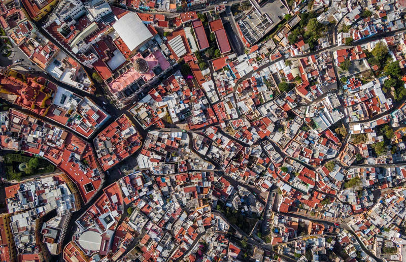 Bird's-eye views you won't believe are real, Konditaget Luders, Copenhagen, Denmark, Ajuda Botanical Garden, Lisbon, Portugal, Henningsvaer football pitch, Lofoten Islands, Norway, Guanajuato, Mexico, Innis Chonnel Castle, Loch Awe, Scotland, Tegallalang rice terraces, Indonesia, Hong Kong, Salt Pans, Gozo, Malta, Shark Fin Cove, Davenport, California, USA, Koh Lipe, Thailand, Golden Gate Bridge, San Francisco, California, USA, Grace Bay, Turks and Caicos Islands, Namib Desert, Namibia, Transfagarasan, Romania, Niagara Falls, Canada/USA, New York City, New York, USA, Road near Laki Volcano, Iceland, Atacama Desert, Chile, San Francisco, California, USA, Na Pali Coast State Wilderness Park, Kauai Island, Hawaii, USA, Yan'an Elevated Road Interchange, Shanghai, China, Navagio Beach, Zakynthos, Greece, Forests around Berthoud Pass, Colorado, USA, Maasai Mara National Reserve, Kenya, Estrada Marginal Norte, Peniche, Portugal, Twelve Apostles, Victoria, Australia, Wongwian Yai, Bangkok, Thailand, Choui Fong Tea Farm, Thailand, Rogers Centre, Toronto, Canada, Silhouette Island, Seychelles, Richfield County Park, Davison, Michigan, USA, Fez, Morocco, Cleopatra Beach, Turkey, Okavango Delta, Botswana, Ningaloo Marine Park, Exmouth, Australia, Mekong Delta, Vietnam, Copacabana Beach, Rio de Janeiro, Brazil, Rheinschlucht, Versam, Switzerland, Colonia de Sant Jordi, Ses Salines, Mallorca, Spain, Sheikh Zayed Road Interchange 1, Dubai, UAE, Zhangye National Geopark, China, Lavender fields in Provence, France, Shifen Waterfall, Taiwan, Misfat Al Abriyeen, Oman, Dubrovnik, Croatia, Clarence Battery, Guernsey, UK, Hverir Geothermal Area, Iceland, Chapman Peak Drive, Cape Town, South Africa, Ronda, Malaga, Spain, Jokulsarlon, Iceland, Rub' Al Khali, Arabian Desert, Vaavu Atoll, Maldives, Bled Island, Slovenia, Gorreana Tea Factory, the Azores, Portugal, Pyrgos Kallistis, Santorini, Greece, Croyde Bay, Devon, UK, Bay of Kotor, Montenegro, Joffre Lakes Provincial Park, Canada, Grand Prismatic Spring, Yellowstone National Park, Wyoming, USA