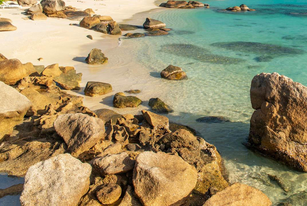 20. Anchor Bay Beach - Australia 50. Rabbit Beach - Italy, 49. Eagle Beach - Aruba, 48. Kynance Cove - United Kingdom, 47. Varadero Beach - Cuba, 46. Cathedral Cove Beach - New Zealand, 45. Bon Bon Beach - Philippines, 44. Henderson Beach - Florida, United States, 43. Cayo Levantado - Dominican Republic, 42. Pipe Creek Sandbar - Bahamas, 41. Diamond Beach - Iceland, 40. Kapalua Bay Beach - Hawaii, United States, 39. Kelingking Beach - Indonesia, 38. Playa Xpu Ha - Mexico, 37. Colombier Beach - St Barth, 36. Kelebekler Vadisi - Turkey, 35. Baia do Sancho - Brazil, 34. Grand Anse - Grenada, 33. Wharton Beach - Australia, 32. Boulders Beach - South Africa, 31. Cayo Zapatilla - Panama, 30. Maundays Bay - Anguilla, 29. Fteri Beach - Greece, 28. Horseshoe Bay - Bermuda, 27. Grote Knip - Curaçao, 26. Seven Mile Beach - Cayman Islands, 25. Praia da Marinha - Portugal, 24. Cayo de Agua - Venezuela, 23. Freedom Beach - Thailand, 22. Anse Source D'Argent - Seychelles, 21. Gardner Bay - Ecuador, 20. Anchor Bay Beach - Australia, 19. Cala Goloritze - Italy, 18. Puinn Sand Beach - Norway, 17. Grace Bay - Turks and Caicos, 16. Playa Balandra - Mexico, 15. One Foot Island - Cook Islands, 14. Lanikai Beach - Hawaii, United States, 13. Aharen Beach - Japan, 12. Le Morne Beach - Mauritius, 11. Calo des Moro - Spain, 10. Horse Shoe Island - Myanmar, 09. Green Lagoon - French Polynesia, 08. Anse Georgette - Seychelles, 07. Pink Beach - Indonesia, 06. Turquoise Bay - Australia, 05. Voutoumi Beach - Greece, 04. Entalula Beach - Philippines, 03. Meads Bay - Anguilla, 02. Cala Mariolu - Italy, 01. Trunk Bay, St. John - US Virgin Islands