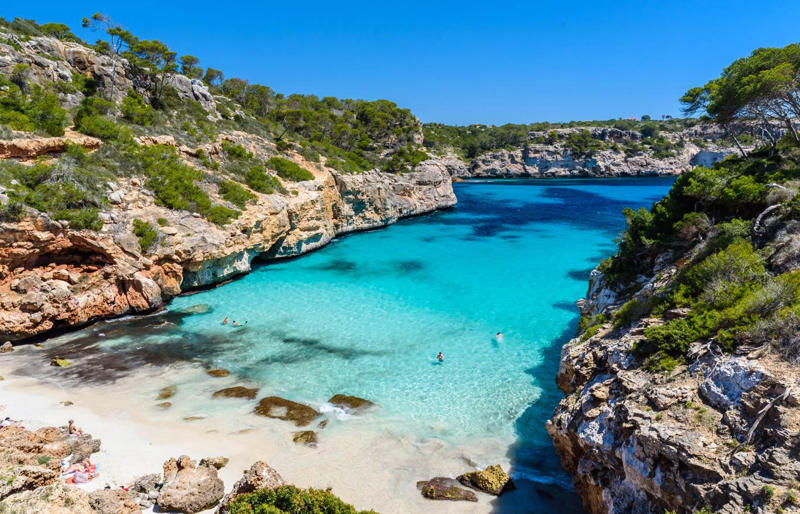 11. Calo des Moro - Spain 50. Rabbit Beach - Italy, 49. Eagle Beach - Aruba, 48. Kynance Cove - United Kingdom, 47. Varadero Beach - Cuba, 46. Cathedral Cove Beach - New Zealand, 45. Bon Bon Beach - Philippines, 44. Henderson Beach - Florida, United States, 43. Cayo Levantado - Dominican Republic, 42. Pipe Creek Sandbar - Bahamas, 41. Diamond Beach - Iceland, 40. Kapalua Bay Beach - Hawaii, United States, 39. Kelingking Beach - Indonesia, 38. Playa Xpu Ha - Mexico, 37. Colombier Beach - St Barth, 36. Kelebekler Vadisi - Turkey, 35. Baia do Sancho - Brazil, 34. Grand Anse - Grenada, 33. Wharton Beach - Australia, 32. Boulders Beach - South Africa, 31. Cayo Zapatilla - Panama, 30. Maundays Bay - Anguilla, 29. Fteri Beach - Greece, 28. Horseshoe Bay - Bermuda, 27. Grote Knip - Curaçao, 26. Seven Mile Beach - Cayman Islands, 25. Praia da Marinha - Portugal, 24. Cayo de Agua - Venezuela, 23. Freedom Beach - Thailand, 22. Anse Source D'Argent - Seychelles, 21. Gardner Bay - Ecuador, 20. Anchor Bay Beach - Australia, 19. Cala Goloritze - Italy, 18. Puinn Sand Beach - Norway, 17. Grace Bay - Turks and Caicos, 16. Playa Balandra - Mexico, 15. One Foot Island - Cook Islands, 14. Lanikai Beach - Hawaii, United States, 13. Aharen Beach - Japan, 12. Le Morne Beach - Mauritius, 11. Calo des Moro - Spain, 10. Horse Shoe Island - Myanmar, 09. Green Lagoon - French Polynesia, 08. Anse Georgette - Seychelles, 07. Pink Beach - Indonesia, 06. Turquoise Bay - Australia, 05. Voutoumi Beach - Greece, 04. Entalula Beach - Philippines, 03. Meads Bay - Anguilla, 02. Cala Mariolu - Italy, 01. Trunk Bay, St. John - US Virgin Islands