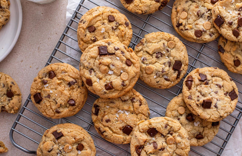 55. Keep baked goods soft with a slice of bread 67. Give breadcrumbs extra flavour, 66. Improve a boxed cake mix, 65. Warm a knife for neat slicing, 64. Make French toast in the slow cooker, 63. Ripen bananas slowly with a banana hanger, 62. Make dressing with almost-empty jars, 61. Use overripe bananas for the best banana bread, 60. Use vegetable water in gravy, 59. Add nutritional yeast for a cheesy flavour, 58. Combine miso and butter for a flavour hit, 57. Make frozen coffee cubes, 56. Pair your pasta and sauce correctly, 55. Keep baked goods soft with a slice of bread, 54. Use ice cube trays to freeze leftover sauce, 53. Use an ice cream scoop for meatballs, 52. Add sugar to savoury dishes and salt to sweet, 51. Peel tomatoes like a pro, 50. Prep ahead for smoothies, 49. Apply baking soda to stained food storage containers, 48. Try the hedgehog mango trick, 47. Stop syrup sticking to your spoons, 46. Use carbonated drinks for lighter batter, 45. Be creative with ketchup, 44. Buy ovenproof storage containers, 43. Sweeten tomato sauce with a carrot, 42. Make and freeze breakfast burritos, 41. Bulk out sauces with lentils, 40. Mix it up with a mug omelette, 39. Blanch your vegetables, 38. Use orange juice in marinades, 37. Put pasta water to good use, 36. Add beetroot to brownies, 35. Use a cupcake tin for egg muffins, 34. Roast potatoes in mayonnaise, 33. Raise your mac 'n' cheese game with mustard, 32. Score meat skin, 31. Ditch the oven for mug cakes, 30. Freeze fresh ginger, 29. Massage kale, 28. Use bread to stop your sugar clumping, 27. Froth milk the easy way, 26. Say yes to soy sauce on popcorn, 25. Use the microwave to peel garlic, 24. Cook bacon in the microwave, 23. Stop soggy sandwiches, 22. Separate onions and potatoes, 21. Use the float test for eggs, 20. Transform cake fails, 19. Use bicarbonate of soda to tenderise meat, 18. Store herby butter in the freezer, 17. Reuse sauce bottles for pancakes, 16. Turn your peanut butter jar upside down, 15. Stop using boiling water for coffee, 14. Use a hand mixer for mashed potatoes, 13. Microwave pizza with water, 12. Grate butter for easy spreading, 11. Microwave lemons to get more juice, 10. Make hash browns in your waffle iron, 9. Use a wine bottle as a rolling pin, 8. Use mayonnaise for perfect toasties, 7. Revive old bread with water, 6. Use your microwave for baked potatoes, 5. Rescue burnt biscuits with a grater, 4. Salvage split Hollandaise, 3. Poach eggs in cling film, 2. Store herbs like flowers