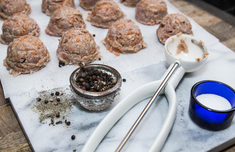 53. Use an ice cream scoop for meatballs 67. Give breadcrumbs extra flavour, 66. Improve a boxed cake mix, 65. Warm a knife for neat slicing, 64. Make French toast in the slow cooker, 63. Ripen bananas slowly with a banana hanger, 62. Make dressing with almost-empty jars, 61. Use overripe bananas for the best banana bread, 60. Use vegetable water in gravy, 59. Add nutritional yeast for a cheesy flavour, 58. Combine miso and butter for a flavour hit, 57. Make frozen coffee cubes, 56. Pair your pasta and sauce correctly, 55. Keep baked goods soft with a slice of bread, 54. Use ice cube trays to freeze leftover sauce, 53. Use an ice cream scoop for meatballs, 52. Add sugar to savoury dishes and salt to sweet, 51. Peel tomatoes like a pro, 50. Prep ahead for smoothies, 49. Apply baking soda to stained food storage containers, 48. Try the hedgehog mango trick, 47. Stop syrup sticking to your spoons, 46. Use carbonated drinks for lighter batter, 45. Be creative with ketchup, 44. Buy ovenproof storage containers, 43. Sweeten tomato sauce with a carrot, 42. Make and freeze breakfast burritos, 41. Bulk out sauces with lentils, 40. Mix it up with a mug omelette, 39. Blanch your vegetables, 38. Use orange juice in marinades, 37. Put pasta water to good use, 36. Add beetroot to brownies, 35. Use a cupcake tin for egg muffins, 34. Roast potatoes in mayonnaise, 33. Raise your mac 'n' cheese game with mustard, 32. Score meat skin, 31. Ditch the oven for mug cakes, 30. Freeze fresh ginger, 29. Massage kale, 28. Use bread to stop your sugar clumping, 27. Froth milk the easy way, 26. Say yes to soy sauce on popcorn, 25. Use the microwave to peel garlic, 24. Cook bacon in the microwave, 23. Stop soggy sandwiches, 22. Separate onions and potatoes, 21. Use the float test for eggs, 20. Transform cake fails, 19. Use bicarbonate of soda to tenderise meat, 18. Store herby butter in the freezer, 17. Reuse sauce bottles for pancakes, 16. Turn your peanut butter jar upside down, 15. Stop using boiling water for coffee, 14. Use a hand mixer for mashed potatoes, 13. Microwave pizza with water, 12. Grate butter for easy spreading, 11. Microwave lemons to get more juice, 10. Make hash browns in your waffle iron, 9. Use a wine bottle as a rolling pin, 8. Use mayonnaise for perfect toasties, 7. Revive old bread with water, 6. Use your microwave for baked potatoes, 5. Rescue burnt biscuits with a grater, 4. Salvage split Hollandaise, 3. Poach eggs in cling film, 2. Store herbs like flowers
