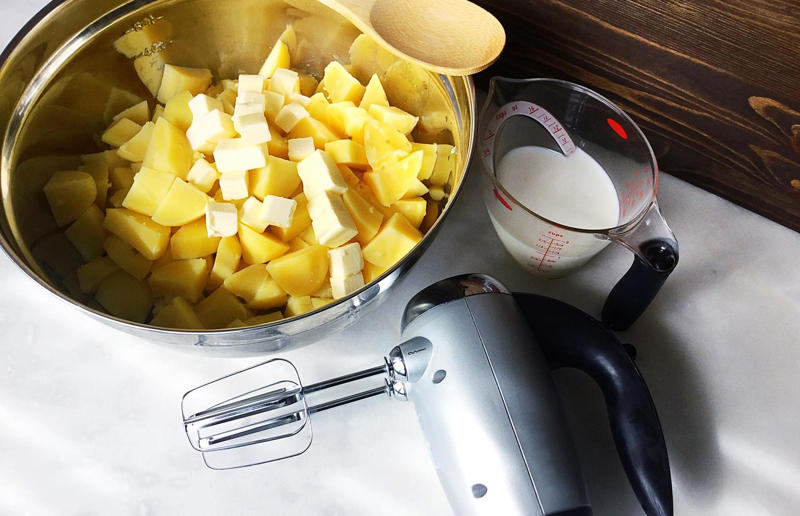 14. Use a hand mixer for mashed potatoes 67. Give breadcrumbs extra flavour, 66. Improve a boxed cake mix, 65. Warm a knife for neat slicing, 64. Make French toast in the slow cooker, 63. Ripen bananas slowly with a banana hanger, 62. Make dressing with almost-empty jars, 61. Use overripe bananas for the best banana bread, 60. Use vegetable water in gravy, 59. Add nutritional yeast for a cheesy flavour, 58. Combine miso and butter for a flavour hit, 57. Make frozen coffee cubes, 56. Pair your pasta and sauce correctly, 55. Keep baked goods soft with a slice of bread, 54. Use ice cube trays to freeze leftover sauce, 53. Use an ice cream scoop for meatballs, 52. Add sugar to savoury dishes and salt to sweet, 51. Peel tomatoes like a pro, 50. Prep ahead for smoothies, 49. Apply baking soda to stained food storage containers, 48. Try the hedgehog mango trick, 47. Stop syrup sticking to your spoons, 46. Use carbonated drinks for lighter batter, 45. Be creative with ketchup, 44. Buy ovenproof storage containers, 43. Sweeten tomato sauce with a carrot, 42. Make and freeze breakfast burritos, 41. Bulk out sauces with lentils, 40. Mix it up with a mug omelette, 39. Blanch your vegetables, 38. Use orange juice in marinades, 37. Put pasta water to good use, 36. Add beetroot to brownies, 35. Use a cupcake tin for egg muffins, 34. Roast potatoes in mayonnaise, 33. Raise your mac 'n' cheese game with mustard, 32. Score meat skin, 31. Ditch the oven for mug cakes, 30. Freeze fresh ginger, 29. Massage kale, 28. Use bread to stop your sugar clumping, 27. Froth milk the easy way, 26. Say yes to soy sauce on popcorn, 25. Use the microwave to peel garlic, 24. Cook bacon in the microwave, 23. Stop soggy sandwiches, 22. Separate onions and potatoes, 21. Use the float test for eggs, 20. Transform cake fails, 19. Use bicarbonate of soda to tenderise meat, 18. Store herby butter in the freezer, 17. Reuse sauce bottles for pancakes, 16. Turn your peanut butter jar upside down, 15. Stop using boiling water for coffee, 14. Use a hand mixer for mashed potatoes, 13. Microwave pizza with water, 12. Grate butter for easy spreading, 11. Microwave lemons to get more juice, 10. Make hash browns in your waffle iron, 9. Use a wine bottle as a rolling pin, 8. Use mayonnaise for perfect toasties, 7. Revive old bread with water, 6. Use your microwave for baked potatoes, 5. Rescue burnt biscuits with a grater, 4. Salvage split Hollandaise, 3. Poach eggs in cling film, 2. Store herbs like flowers