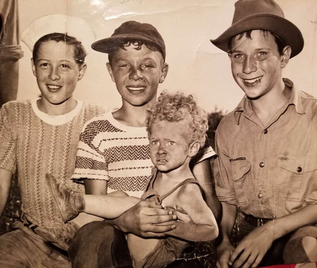 1. "Three boys, including my grandfather (right), find a missing child in a corn field after a town-wide, day-long search in 1942.", 2. "Six-year-old Richard Baranski after winning a contest by eating a 10-inch cranberry pie in 15 seconds in 1948.", 3. "My Grandpa's mugshot when entering a WWII POW camp in the 1940s.", 4. Woman holding a bundle of fresh-picked gladiolus flowers at Terra Ceia Island, Florida, 5. "Here is my Grandma in the late 1940s on vacation.", 6. "A photograph I found hanging inside a small town diner from the 1940s.", 7. "Grand Central Station in 1941", 8. "Margaret Hamilton reuniting with her Wizard of Oz co-star on the set of Twin Beds (1942).", 9. "Disney artists study a deer for Bambi in 1942.", 10. "My weightlifter Great Grandpa holding my grandpa over his head in 1947.", 11. "I never realized Lucille Ball was so hot. Circa 1940s at a bowling alley.", 12. "Civil Air Patrol student pilot at the Silver Lake airfield near Baker, California in 1944.", 13. "My Grandpa selling melons from his car in 1941.", 14. A man begging for his wife's forgiveness inside a Divorce Court in Chicago, 1948, 15. "This was the 'Bicycle of the Future' in 1946", 16. "Two sailors sleeping off their celebration of the end of WWII in 1945.", 17. "The Zoot Suit in the 1940s", 18. Kids dancing in the street in NYC in the 1940s., 19. "A modeling photo of my Great Aunt Frizti (Frances), 1941", 20. "My Grandpa posing with his freshly caught sawfish in the 1940s.", 21. "Father passes out when he meets his triplets for the first time in 1946.", 22. "My Grandfather on my Grandmother's shoulders sometime in the 1940s.", 23. "My grandpa looked suave in the 1940s.", 24. "Southside Chicago, Easter 1941", 25. "Shirley Temple posing by a painting of young Shirley Temple in 1945.", 26. "Captain 'Waddy' Young and crew pose in front of their caricatures on their B-29 Superfortress on 11/24/44.", 27. "Robert De Niro aged three with his 24-year-old father Robert De Niro Sr. in 1946.", 28. "1946 mugshot of Paul Newman (age 21) after being arrested with five others for making trouble at Kenyon College.", 29. "Arctic explorer Peter Freuchen and his wife Dagmar Gale in 1947.", 30. "Sean Connery in the Royal Navy in 1946.", 31. "George Carlin on West 121st street, Manhattan, in 1947.", 32. "As soviet troops approached Berlin in 1945, citizens did their best to take care of Berlin Zoo's animals.", 33. "My Grandfather channeling the mafia at the Bronx Zoo in 1942.", 34. "A pig photo-bombing a wedding in the 1940s", 35. "Winston Churchill during a training day for D-Day circa 1944. Eisenhower is just there on his right on the firing line.", 36. "My grandma hanging out with Albert Einstein in her backyard around 1945.", 37. "Great Grandmother (on the right) in the 1940s in Cuba.", 38. "My grandmother with Sultan, her favorite lion from her troop, in front of her plane that she flew just after WWII in 1947.", 39. "WWII refugee children seeing the Statue of Liberty as they entered the United States in 1946.", 40. "Judy Garland and her daughter, Liza Minnelli, in 1947.", 41. "Babe Ruth and Yogi Berra in 1947.", 42. "Tuskegee airmen in Italy, 1945", 43. "My grandfather competing in motorcycle trials in 1947.", 44. "Military Police in Times Square on New Year's Eve, as 1941 turns to 1942.", 45. "Students in Brooklyn in 1945 protesting the 'no pants to school' rule.", 46. "My great aunt and her 'best friend' (girlfriend of 30+ years) working in the factory where they met in 1947.", 47. "A windy day in Philadelphia in 1947.", 48. "Size of the donut hole down through the years (1927-1948)", 49. "Two men at the NYC Greyhound Bust Terminal in 1947.", 50. My grandpa in 1948 looked like a total model.", 51. "Discovering the Mona Lisa after the end of WWII in 1945.", 52. "This impeccably dressed woman shopping for groceries with her son in 1945.", 53. "Young Ella Fitzgerald in 1945.", 54. "Royal Air Force pilot getting a haircut during a break between missions, Britain, 1942.", 55. "Two sharply dressed young men in Natchez, Mississippi in 1947.", 56. "My Grandmother for a photoshoot in Cuba circa 1940s", 57. "Teenagers at a party in Tula, Oklahoma in 1947.", 58. "Marilyn Monroe babysitting for a studio co-worker in 1947.", 59. "A bubble glass roof of a car in 1947.", 60. "Assembling the Sports Section of the New York Times in 1942", 61. "Boy watches TV for the first time from an appliance store window in 1948.", 62. "Woman wiring an early IBM computer in 1948.", 63. "Kids reading comics in NYC, 1947.", 64. "Native Americans win the right to register and vote in New Mexico, 1948.", 65. "My Grandma and Grandpa showing off the catch of the day in 1948.", 66. "My Grandpa and his dog in the early 1940s.", 67. "In the 1940s, men dressed in short shorts and cowboy boots serving women at a drive-in in Dallas.", 68. "My grandfather (left) and a friend in front of the Central Station Hamburg in 1948. He was a chimney sweep.", 69. "My great aunt and her 'special friend' in Nashville in the 1940s.", 70. "My grandfather with his puppy in 1948.", 71. "My grandparents the summer they met in 1948 while they were both working at the Glacier National Park.", 72. "Ukrainian women take up 'tommy-guns' for service in regular guerilla units in 1942.", 73. "Winter in Times Square, 1947.", 74. A curious Italian woman inspects the kilt of a Scottish soldier near the Coliseum after the liberation of Rome in 1944., 75. "My grandparents' honeymoon in Switzerland in 1946.", 76. "Drive-in movie theater in San Francisco in 1948.", 77. London in 1949, 78. "My grandparents who were high school sweethearts at Brighton Beach in 1948.", 79. "My Grandpa's worker ID from working the railroads in 1943.", 80. Trainees of the LAPS practice firing their new revolvers in 1948., 81. The stunningly beautiful Ava Gardner during the MGM employment questionnaire in 1942., 82. Betty White in 1949., 83. "Winnie the welder at the Richmond boatyard in 1943.", 84. "My grandma after she won a North American rollerskating championship in 1949.", 85. French woman pouring tea for a British soldier fighting in Normandy in 1944., 86. A U.S. soldier is trying on the Imperial Crown of the Holy Roman Empire, previously worn by every emperor between the 10th and 19th centuries. Circa 1945., 87. Five men pose for a 'selfie' using the reflection of a chrome hubcap. Taken in Paris in 1942., 88. Young couple on the subway in NYC in 1947., 89. Italian cyclist Gino Sciardis getting his bike lubricated during the 1949 Tour de France., 90. Street scene in Cascade, Idaho, in June 1941.