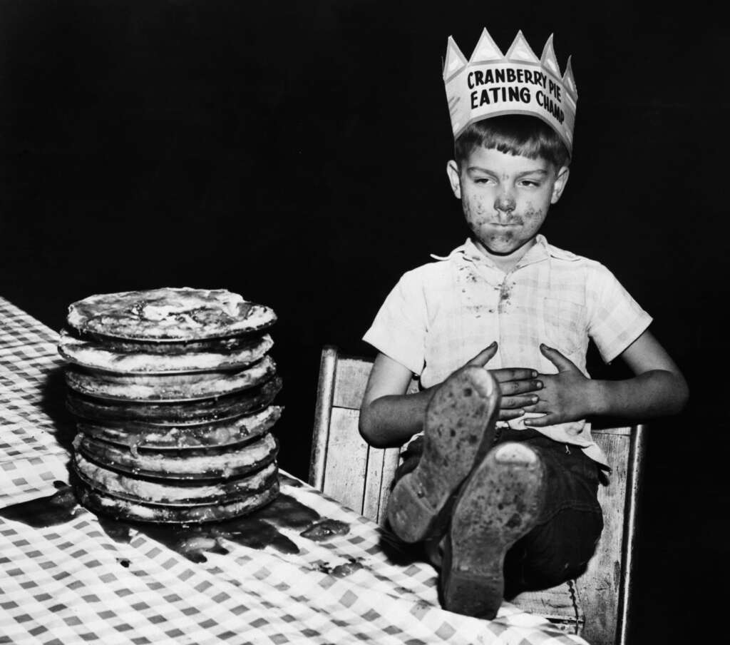 1. "Three boys, including my grandfather (right), find a missing child in a corn field after a town-wide, day-long search in 1942.", 2. "Six-year-old Richard Baranski after winning a contest by eating a 10-inch cranberry pie in 15 seconds in 1948.", 3. "My Grandpa's mugshot when entering a WWII POW camp in the 1940s.", 4. Woman holding a bundle of fresh-picked gladiolus flowers at Terra Ceia Island, Florida, 5. "Here is my Grandma in the late 1940s on vacation.", 6. "A photograph I found hanging inside a small town diner from the 1940s.", 7. "Grand Central Station in 1941", 8. "Margaret Hamilton reuniting with her Wizard of Oz co-star on the set of Twin Beds (1942).", 9. "Disney artists study a deer for Bambi in 1942.", 10. "My weightlifter Great Grandpa holding my grandpa over his head in 1947.", 11. "I never realized Lucille Ball was so hot. Circa 1940s at a bowling alley.", 12. "Civil Air Patrol student pilot at the Silver Lake airfield near Baker, California in 1944.", 13. "My Grandpa selling melons from his car in 1941.", 14. A man begging for his wife's forgiveness inside a Divorce Court in Chicago, 1948, 15. "This was the 'Bicycle of the Future' in 1946", 16. "Two sailors sleeping off their celebration of the end of WWII in 1945.", 17. "The Zoot Suit in the 1940s", 18. Kids dancing in the street in NYC in the 1940s., 19. "A modeling photo of my Great Aunt Frizti (Frances), 1941", 20. "My Grandpa posing with his freshly caught sawfish in the 1940s.", 21. "Father passes out when he meets his triplets for the first time in 1946.", 22. "My Grandfather on my Grandmother's shoulders sometime in the 1940s.", 23. "My grandpa looked suave in the 1940s.", 24. "Southside Chicago, Easter 1941", 25. "Shirley Temple posing by a painting of young Shirley Temple in 1945.", 26. "Captain 'Waddy' Young and crew pose in front of their caricatures on their B-29 Superfortress on 11/24/44.", 27. "Robert De Niro aged three with his 24-year-old father Robert De Niro Sr. in 1946.", 28. "1946 mugshot of Paul Newman (age 21) after being arrested with five others for making trouble at Kenyon College.", 29. "Arctic explorer Peter Freuchen and his wife Dagmar Gale in 1947.", 30. "Sean Connery in the Royal Navy in 1946.", 31. "George Carlin on West 121st street, Manhattan, in 1947.", 32. "As soviet troops approached Berlin in 1945, citizens did their best to take care of Berlin Zoo's animals.", 33. "My Grandfather channeling the mafia at the Bronx Zoo in 1942.", 34. "A pig photo-bombing a wedding in the 1940s", 35. "Winston Churchill during a training day for D-Day circa 1944. Eisenhower is just there on his right on the firing line.", 36. "My grandma hanging out with Albert Einstein in her backyard around 1945.", 37. "Great Grandmother (on the right) in the 1940s in Cuba.", 38. "My grandmother with Sultan, her favorite lion from her troop, in front of her plane that she flew just after WWII in 1947.", 39. "WWII refugee children seeing the Statue of Liberty as they entered the United States in 1946.", 40. "Judy Garland and her daughter, Liza Minnelli, in 1947.", 41. "Babe Ruth and Yogi Berra in 1947.", 42. "Tuskegee airmen in Italy, 1945", 43. "My grandfather competing in motorcycle trials in 1947.", 44. "Military Police in Times Square on New Year's Eve, as 1941 turns to 1942.", 45. "Students in Brooklyn in 1945 protesting the 'no pants to school' rule.", 46. "My great aunt and her 'best friend' (girlfriend of 30+ years) working in the factory where they met in 1947.", 47. "A windy day in Philadelphia in 1947.", 48. "Size of the donut hole down through the years (1927-1948)", 49. "Two men at the NYC Greyhound Bust Terminal in 1947.", 50. My grandpa in 1948 looked like a total model.", 51. "Discovering the Mona Lisa after the end of WWII in 1945.", 52. "This impeccably dressed woman shopping for groceries with her son in 1945.", 53. "Young Ella Fitzgerald in 1945.", 54. "Royal Air Force pilot getting a haircut during a break between missions, Britain, 1942.", 55. "Two sharply dressed young men in Natchez, Mississippi in 1947.", 56. "My Grandmother for a photoshoot in Cuba circa 1940s", 57. "Teenagers at a party in Tula, Oklahoma in 1947.", 58. "Marilyn Monroe babysitting for a studio co-worker in 1947.", 59. "A bubble glass roof of a car in 1947.", 60. "Assembling the Sports Section of the New York Times in 1942", 61. "Boy watches TV for the first time from an appliance store window in 1948.", 62. "Woman wiring an early IBM computer in 1948.", 63. "Kids reading comics in NYC, 1947.", 64. "Native Americans win the right to register and vote in New Mexico, 1948.", 65. "My Grandma and Grandpa showing off the catch of the day in 1948.", 66. "My Grandpa and his dog in the early 1940s.", 67. "In the 1940s, men dressed in short shorts and cowboy boots serving women at a drive-in in Dallas.", 68. "My grandfather (left) and a friend in front of the Central Station Hamburg in 1948. He was a chimney sweep.", 69. "My great aunt and her 'special friend' in Nashville in the 1940s.", 70. "My grandfather with his puppy in 1948.", 71. "My grandparents the summer they met in 1948 while they were both working at the Glacier National Park.", 72. "Ukrainian women take up 'tommy-guns' for service in regular guerilla units in 1942.", 73. "Winter in Times Square, 1947.", 74. A curious Italian woman inspects the kilt of a Scottish soldier near the Coliseum after the liberation of Rome in 1944., 75. "My grandparents' honeymoon in Switzerland in 1946.", 76. "Drive-in movie theater in San Francisco in 1948.", 77. London in 1949, 78. "My grandparents who were high school sweethearts at Brighton Beach in 1948.", 79. "My Grandpa's worker ID from working the railroads in 1943.", 80. Trainees of the LAPS practice firing their new revolvers in 1948., 81. The stunningly beautiful Ava Gardner during the MGM employment questionnaire in 1942., 82. Betty White in 1949., 83. "Winnie the welder at the Richmond boatyard in 1943.", 84. "My grandma after she won a North American rollerskating championship in 1949.", 85. French woman pouring tea for a British soldier fighting in Normandy in 1944., 86. A U.S. soldier is trying on the Imperial Crown of the Holy Roman Empire, previously worn by every emperor between the 10th and 19th centuries. Circa 1945., 87. Five men pose for a 'selfie' using the reflection of a chrome hubcap. Taken in Paris in 1942., 88. Young couple on the subway in NYC in 1947., 89. Italian cyclist Gino Sciardis getting his bike lubricated during the 1949 Tour de France., 90. Street scene in Cascade, Idaho, in June 1941.