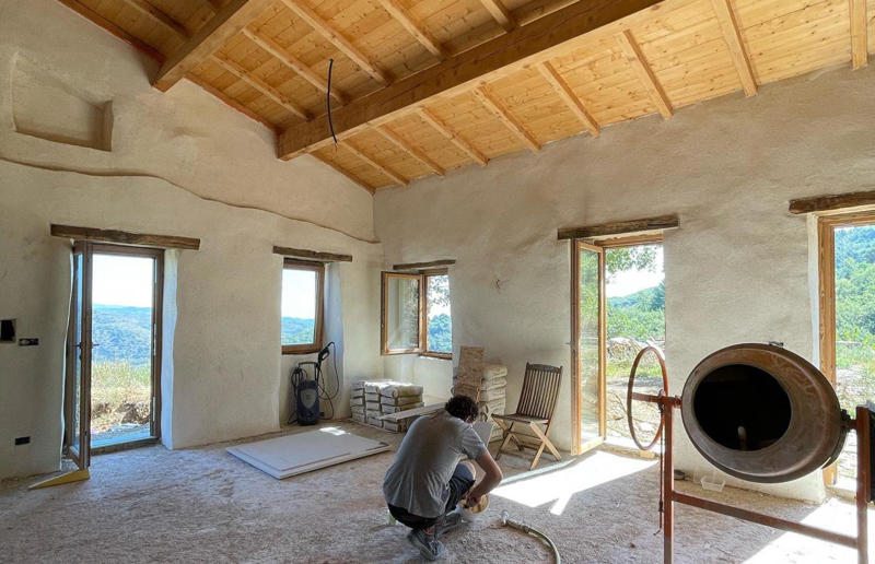 Let there be light! Meet the architects who transformed a 100-year-old ruin into a sustainable home, A meeting of minds, Shopping for a home, Rescuing a ruin, Crumbling but charming, Getting started, Seven garden terraces, Moving inside, Dismantling the roof, Remains of a ruin, Structural issues, Rebuilding the roof, Salvaging materials, Sealing the roof, Old meets new, Eco materials, Starting on the floors, Creating rooms, Insulation, insulation, insulation, Custom windows, Getting airtight, Plastering problems, Dressing the stone, Let there be light!, Laying the floors, Creating a cosy living room, A welcoming living space, Perfect for entertaining, DIY kitchen, An eco-conscious cooking spot, Polished bathroom walls, Ready for a spa session, A reclaimed patio, Breathtaking backyard views, Olives and lavender