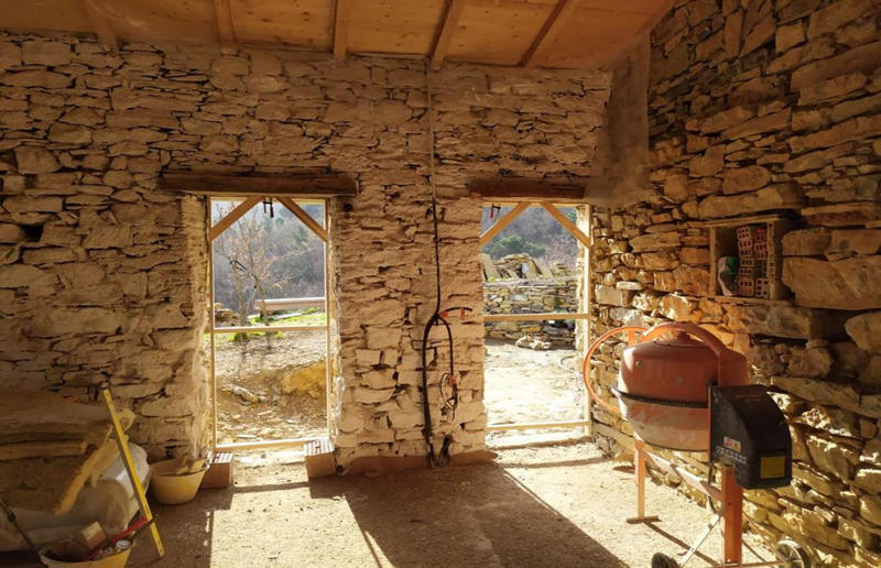Custom windows Meet the architects who transformed a 100-year-old ruin into a sustainable home, A meeting of minds, Shopping for a home, Rescuing a ruin, Crumbling but charming, Getting started, Seven garden terraces, Moving inside, Dismantling the roof, Remains of a ruin, Structural issues, Rebuilding the roof, Salvaging materials, Sealing the roof, Old meets new, Eco materials, Starting on the floors, Creating rooms, Insulation, insulation, insulation, Custom windows, Getting airtight, Plastering problems, Dressing the stone, Let there be light!, Laying the floors, Creating a cosy living room, A welcoming living space, Perfect for entertaining, DIY kitchen, An eco-conscious cooking spot, Polished bathroom walls, Ready for a spa session, A reclaimed patio, Breathtaking backyard views, Olives and lavender