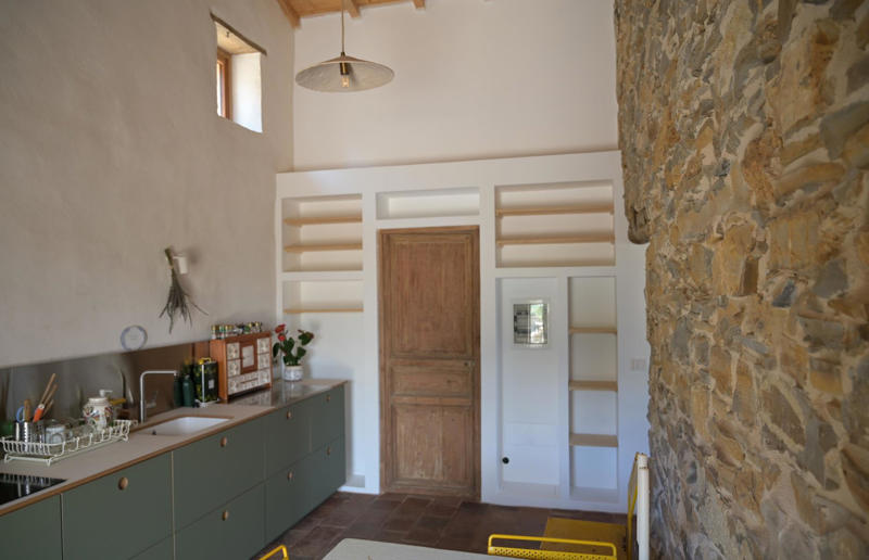 An eco-conscious cooking spot Meet the architects who transformed a 100-year-old ruin into a sustainable home, A meeting of minds, Shopping for a home, Rescuing a ruin, Crumbling but charming, Getting started, Seven garden terraces, Moving inside, Dismantling the roof, Remains of a ruin, Structural issues, Rebuilding the roof, Salvaging materials, Sealing the roof, Old meets new, Eco materials, Starting on the floors, Creating rooms, Insulation, insulation, insulation, Custom windows, Getting airtight, Plastering problems, Dressing the stone, Let there be light!, Laying the floors, Creating a cosy living room, A welcoming living space, Perfect for entertaining, DIY kitchen, An eco-conscious cooking spot, Polished bathroom walls, Ready for a spa session, A reclaimed patio, Breathtaking backyard views, Olives and lavender