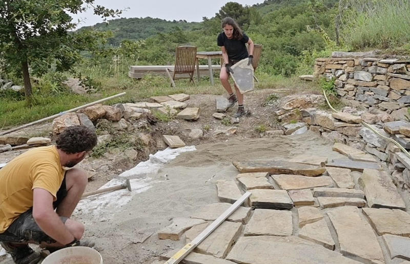 A reclaimed patio Meet the architects who transformed a 100-year-old ruin into a sustainable home, A meeting of minds, Shopping for a home, Rescuing a ruin, Crumbling but charming, Getting started, Seven garden terraces, Moving inside, Dismantling the roof, Remains of a ruin, Structural issues, Rebuilding the roof, Salvaging materials, Sealing the roof, Old meets new, Eco materials, Starting on the floors, Creating rooms, Insulation, insulation, insulation, Custom windows, Getting airtight, Plastering problems, Dressing the stone, Let there be light!, Laying the floors, Creating a cosy living room, A welcoming living space, Perfect for entertaining, DIY kitchen, An eco-conscious cooking spot, Polished bathroom walls, Ready for a spa session, A reclaimed patio, Breathtaking backyard views, Olives and lavender