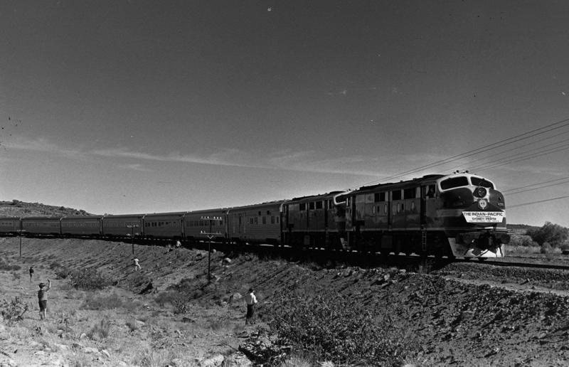1970s: the inaugural journey of the Indian Pacific Rail travel through the ages, 1860s: Royals embrace train travel, 1870s: An early railroad bridge in Arizona, 1880s: Luxurious interior of a railroad car, 1880s: First transcontinental train in Canada, 1890s: Dining car on the Chicago Great Western Limited, 1890s: Barber shop on board a train, 1900s: All about comfort, 1910s: Royals on tour, 1910s: Train travel for everyone, 1910s: Darjeeling Himalayan Railway loop, 1920s: First non-stop service of the Flying Scotsman, 1920s: Swedish State Railways Second Class, 1920s: New entertainment on board, 1930s: Films on trains, 1920s: Holiday rush, 1930s: Sleeping in comfort, 1930s: Battling baggage, 1930s: Summer holidays in the Austrian countryside, 1940s: Long-haul journeys in comfort, 1940s: New luxury trains, 1950s: Lounge on the Southern Pacific Sunset Limited, 1960s: A dream of Eurotunnel, 1960s: High-speed rail travel is unveiled in Japan, 1970s: Dome car of the Southwest Limited, 1970s: The inaugural journey of the Indian Pacific, 1970s: Final journey of the Orient Express, 1980s: Business on the go, 1990s: Passengers en route to the Royal Ascot, 1990s: The late Queen Elizabeth II and Prince Philip aboard Eurostar, 2000s: Amtrak employees in front of the new Acela Express train, 2000s: Aboard the American Orient Express, 2010s: High-speed train travel in China
