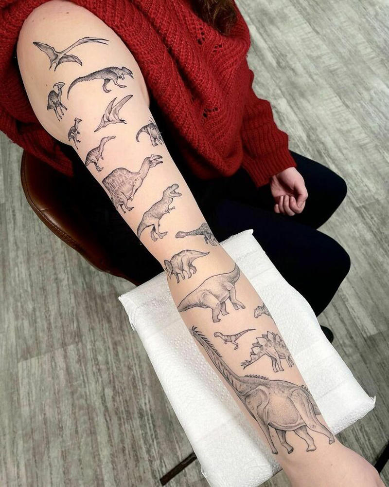 #7 Dinosaur Sleeve #1 Very Colorful Dinosaur, #2 White Stegosaurus Fossil, #4 A Blind Cat Walking His Guiding Velociraptor, #6 Dinosaur Bubble Bath, #7 Dinosaur Sleeve, #8 Gorgeous Work, #9 My Favorite, #10 Ok Google, #11 Furry Little Dinosaur, #12 Super Cute Dino, #13 Siblings' Tattoos, #14 Does Everyone Like Geometric Art? T-Rex Skull, #16 Tattoo Museum, #18 Jungle Dinosaur, #19 Origami T-Rex, #20 My Cartoon Dinosaurs' Tattoo, #21 Dino With Underwater Scene, #22 I Bet This Tea Comes With A Very Special Flavor, #23 Hand-Poked Dinosaur, #24 Yehaaaw, #25 Punk Raptor, #26 Dinos Love Donuts, #27 First Tattoo, #28 Basquiat Dino, #29 We All Live In A Submarine, #30 Raptor. Really Amazing Work, #31 T-Rex Skeleton, #32 Aliens vs. Dinosaurs, #33 T-Rex, #35 Dinosaur Tattoo For Gamers, #37 Uncle Brachiosaurus With His Nephew, #38 Velociraptor, #39 This T-Rex Done By Me, #40 This Guy Is My Neighbor, #41 Dinosaur Sleeve, #42 Walking A T-Rex, #43 Color Realism Velociraptor. Work In Progress, #44 Dinosaur And A Warrior, #46 Just A Man And His Dino